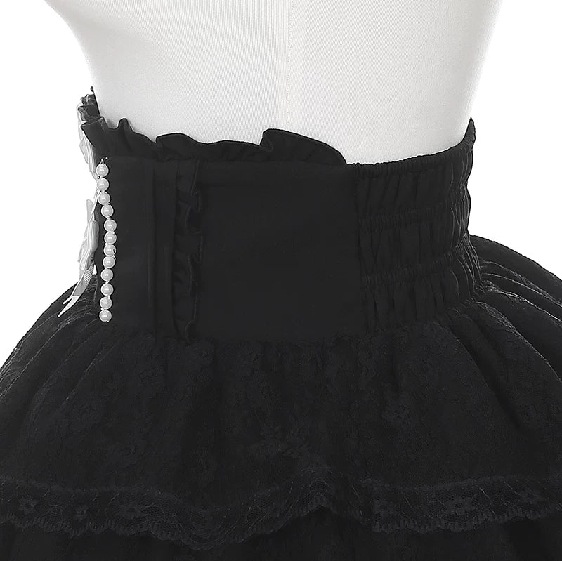 Close-up detail of Jirai Kei skirt waist featuring ruffled high waist pearl chain decoration shirred elastic back studio display