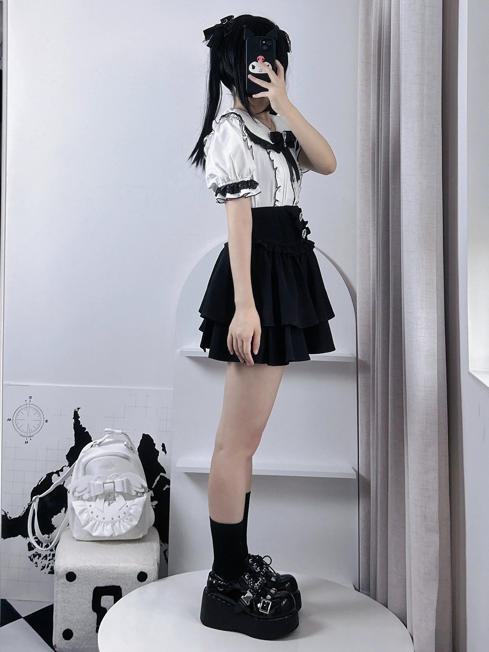 Jirai kei tiered skirt flat lay showing pleated waist structure, heart-shaped rhinestone details, adjustable elastic waistband construction