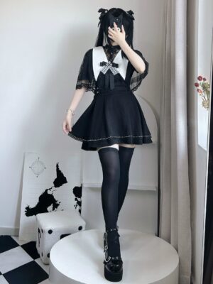 Jirai Kei angel wing collar blouse with puritan neckline and detachable cape front view studio shot