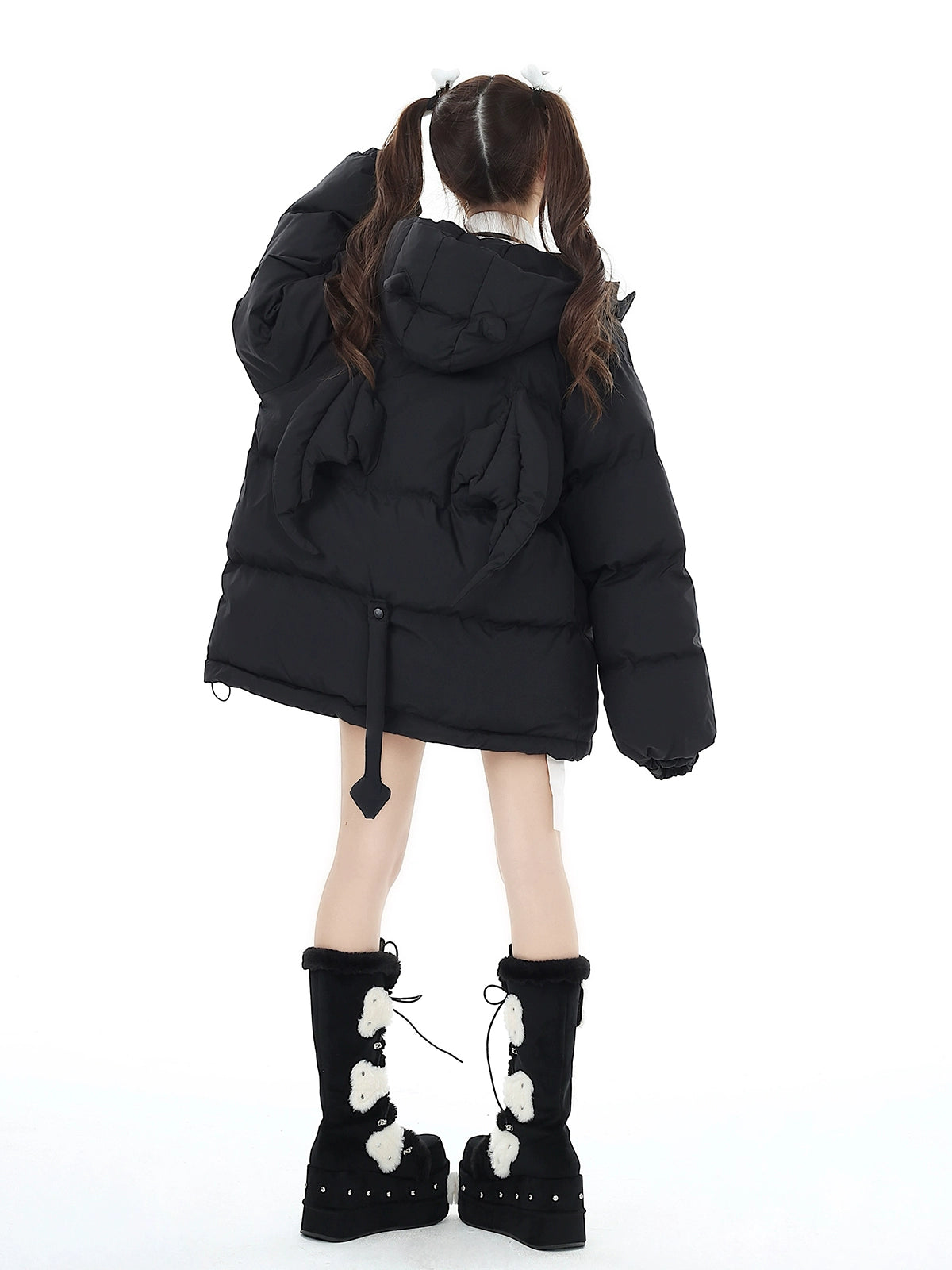 Black Jirai Kei winter coat elastic cuffs raglan sleeve construction showing movement and comfort design engineering