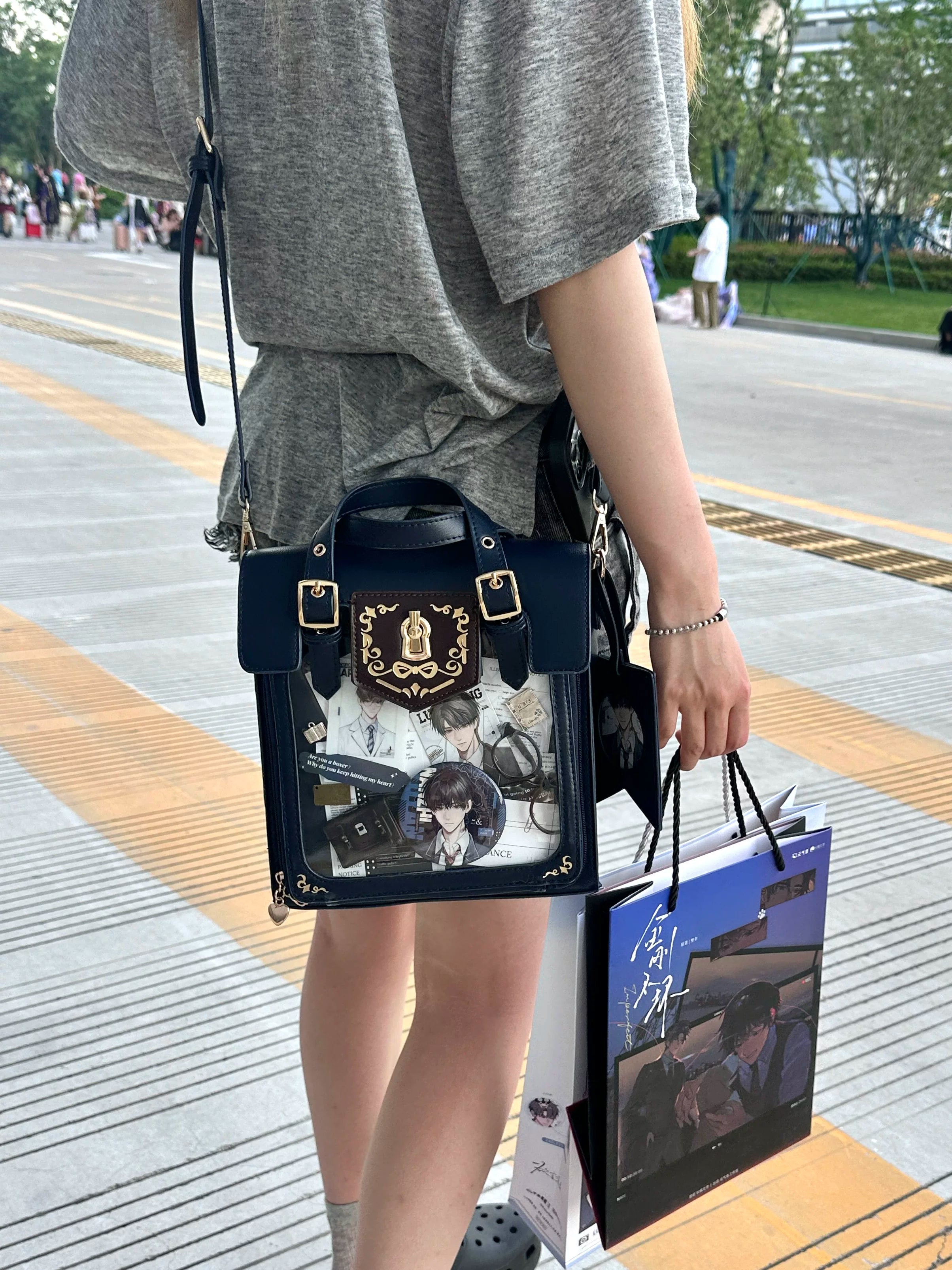 Premium vintage Jirai Kei ita satchel bag with embroidered details and luxurious gold metal accents, featuring crystal-clear transparent display window and compact square silhouette