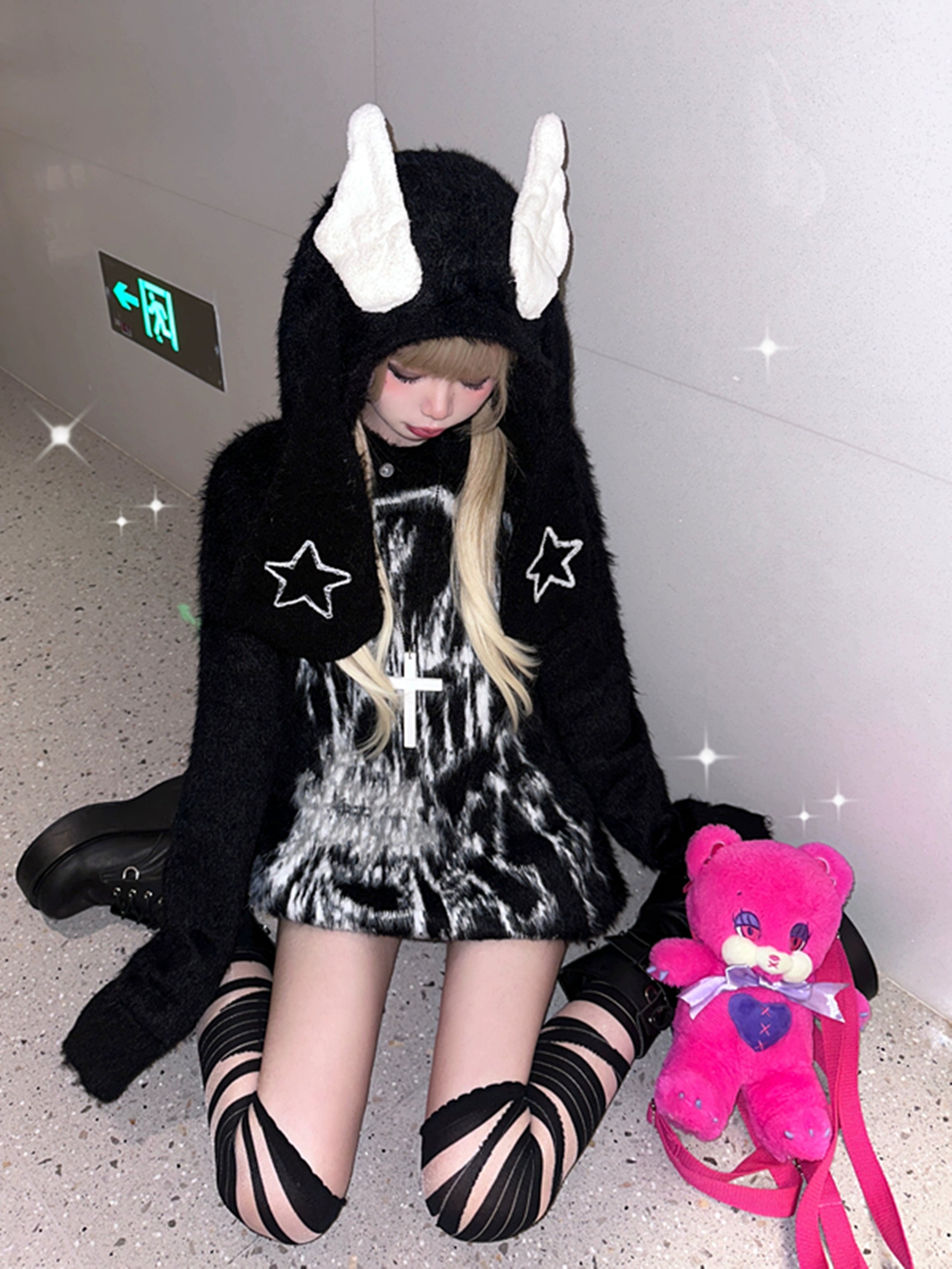 Jirai kei bunny ear wing hooded sweater detail view showing removable ear hood attachment mechanism design feature