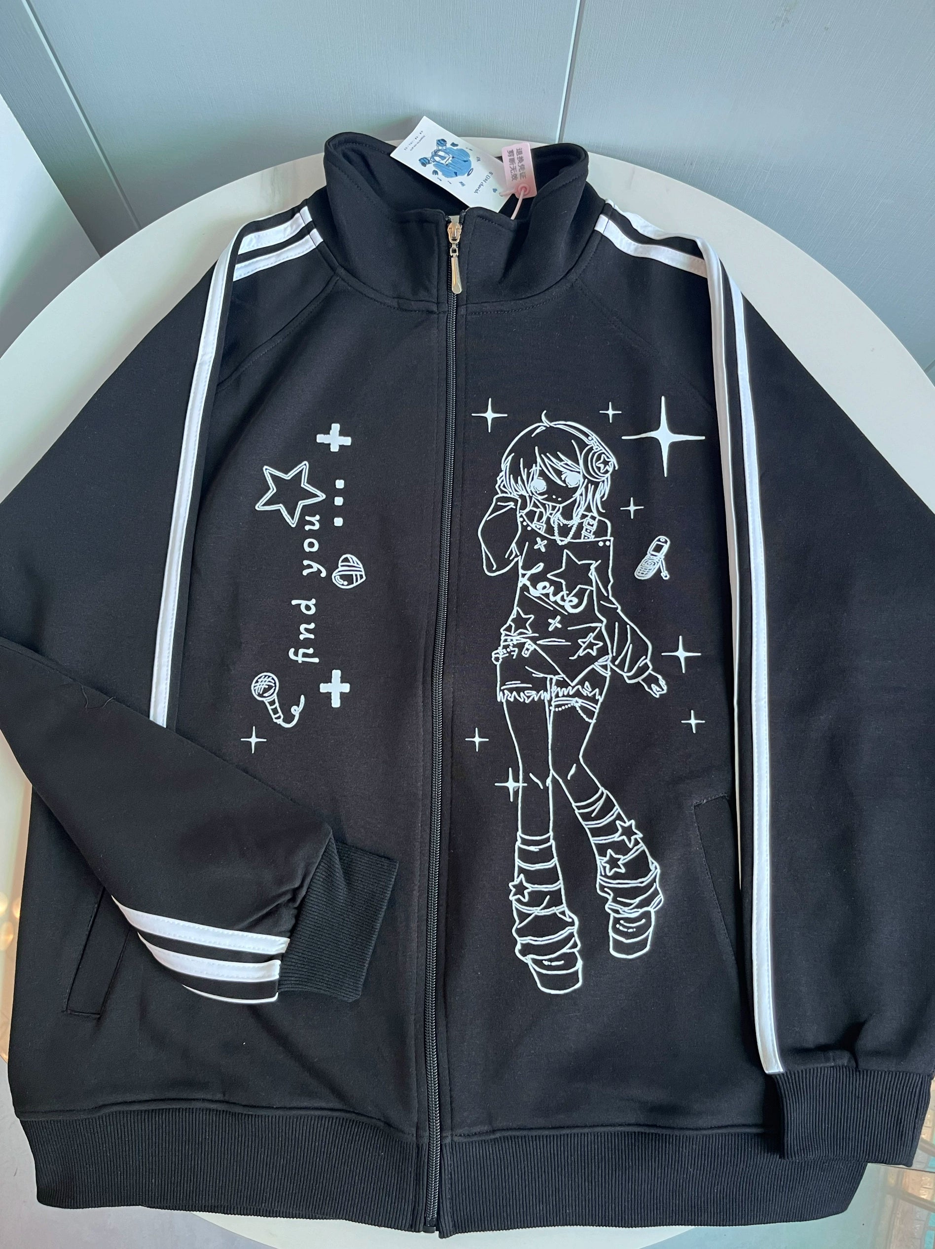 black stand collar zip-up jacket side pocket detail showing functional design elements and oversized silhouette construction