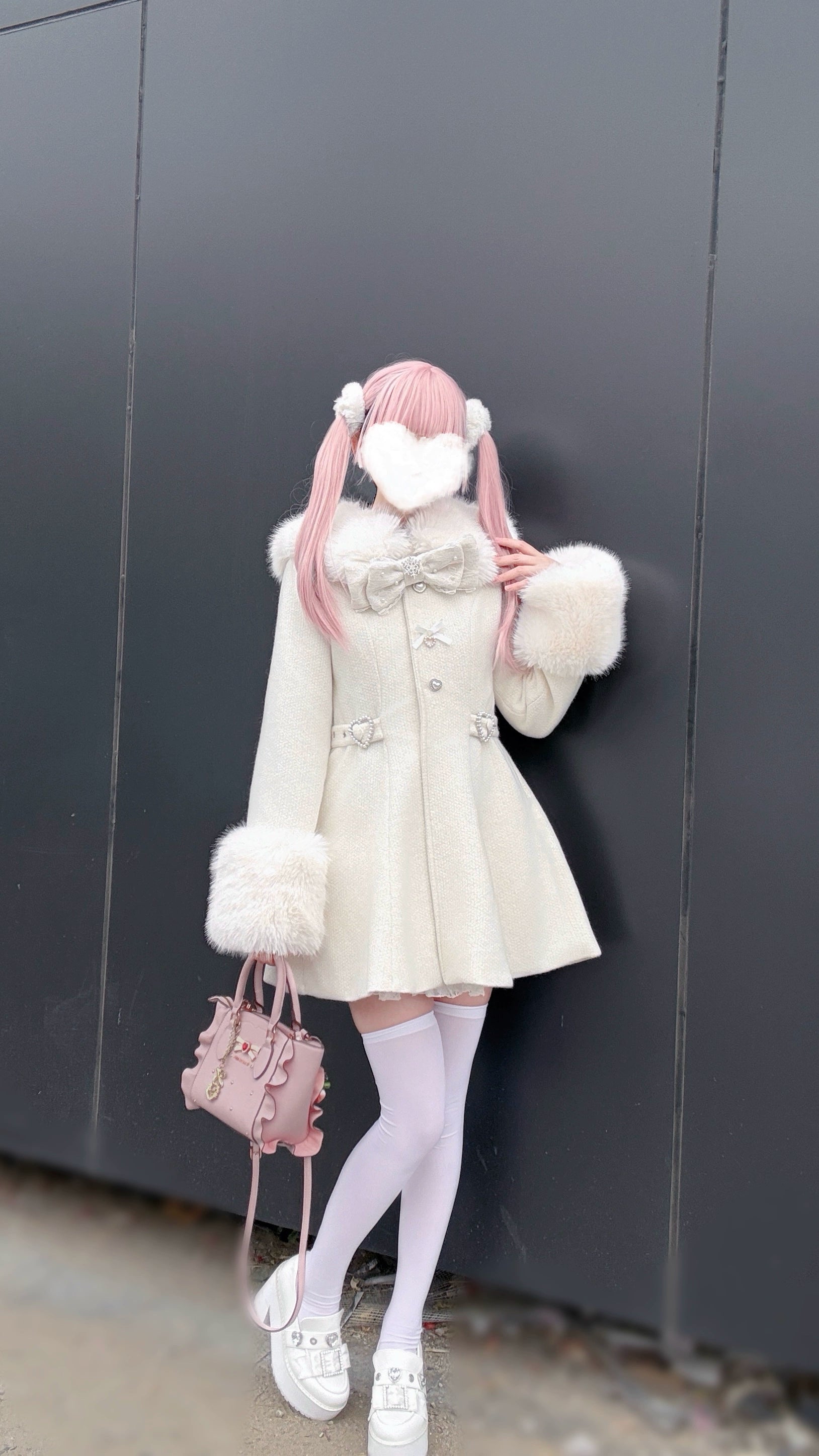 Beige Ryousangata winter coat worn with white stockings and sneakers carrying pink handbag outdoor-style background Jirai Kei street fashion styling