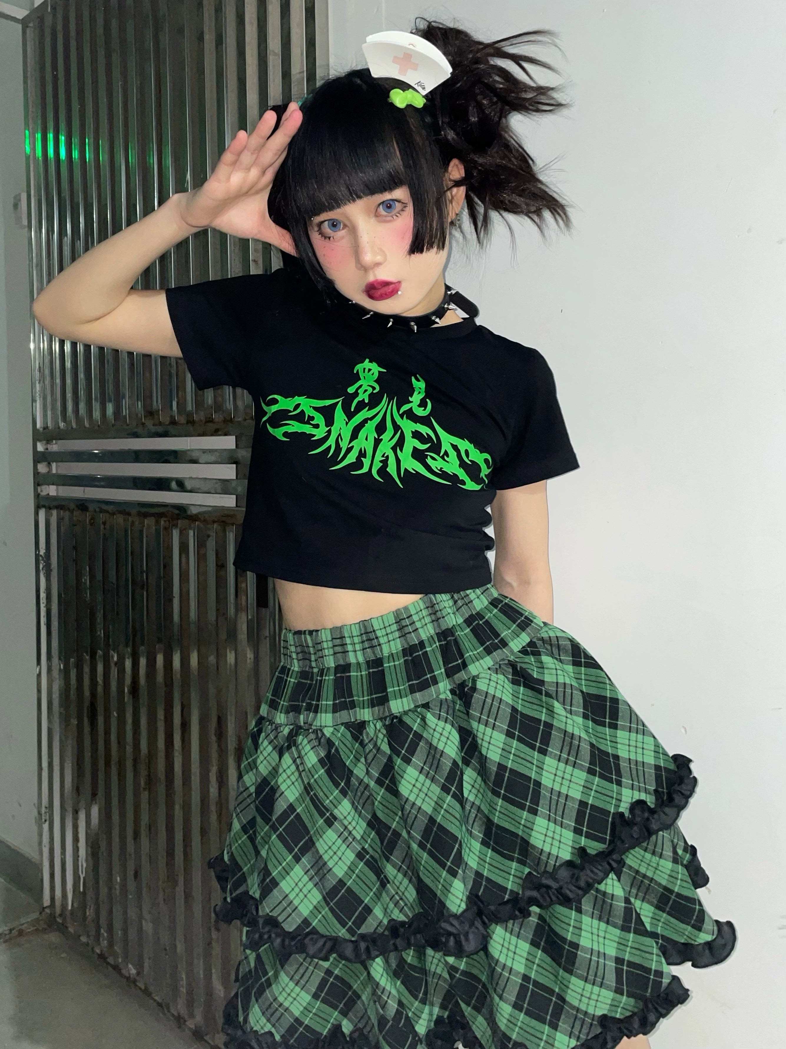 Blue-black plaid Jirai Kei ruffle skirt pink hem contrast detail, dimensional layered ruffles, aesthetic appeal showcase
