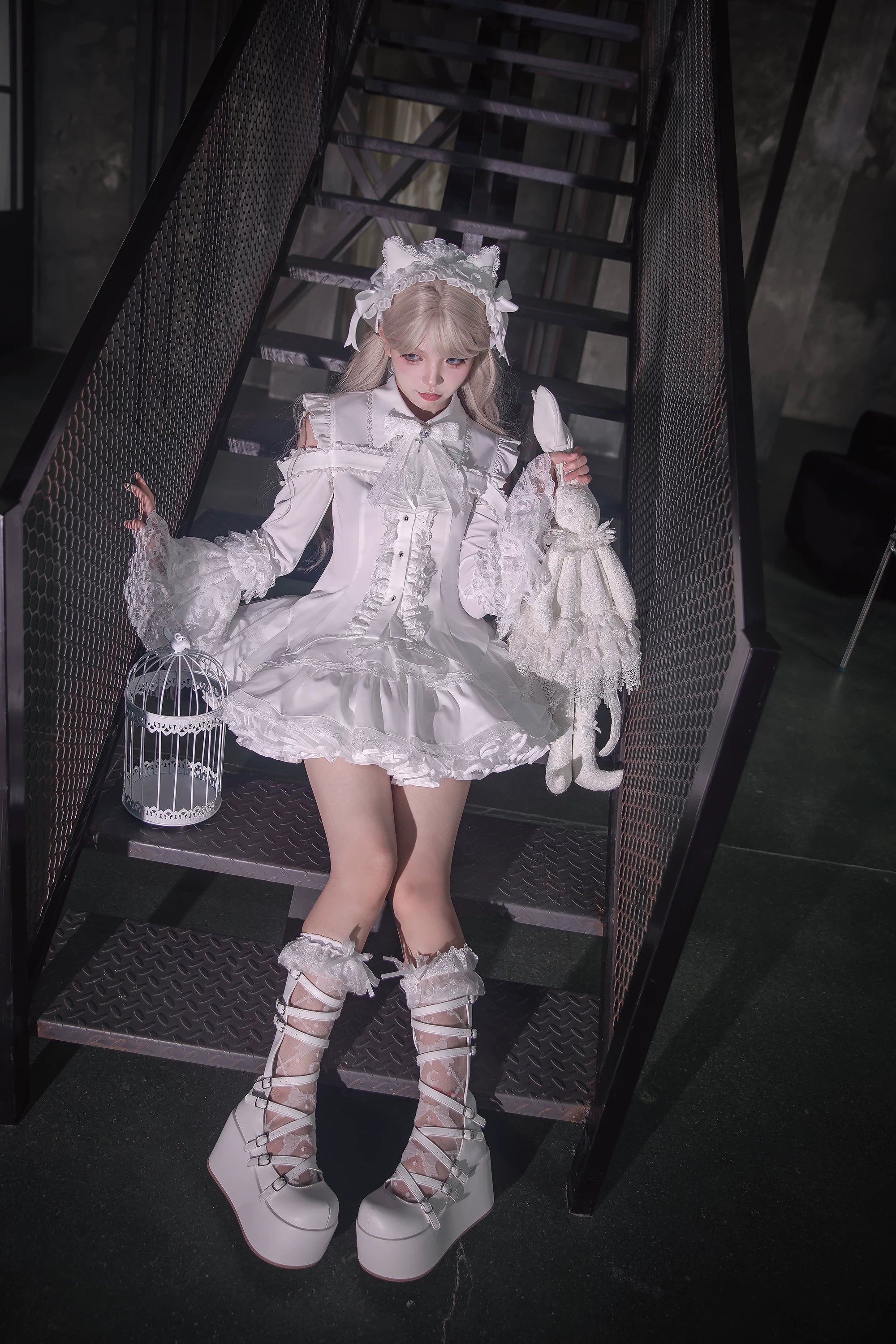 Tiered ruffled skirt construction layered texture dramatic jirai kei aesthetic theatrical fashion detail view