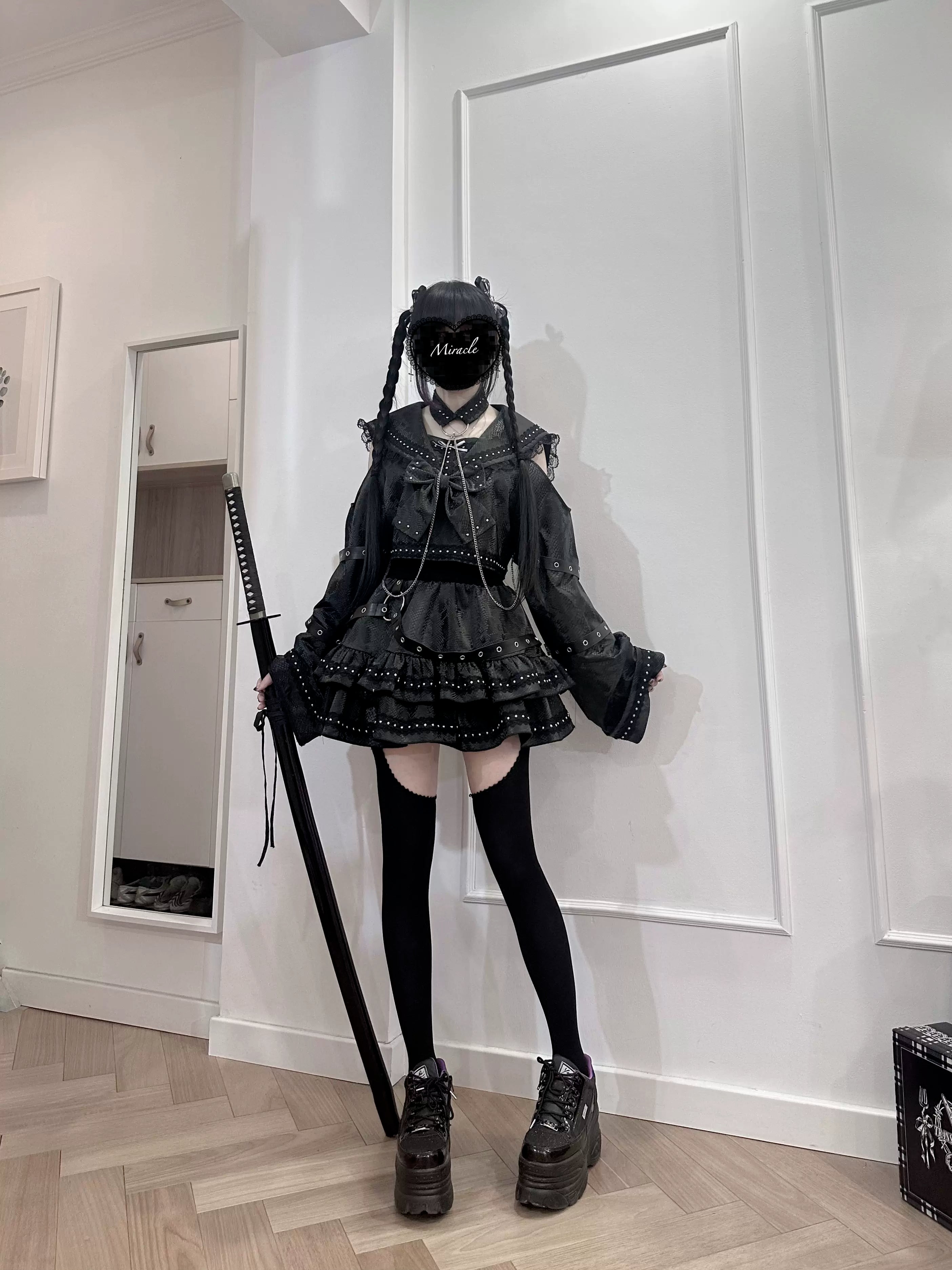 Black gothic sailor outfit set detailed view of tiered ruffle construction chain details and structured waistband engineering