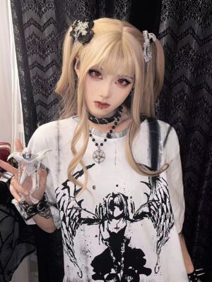 Close-up of celestial angel wings tie-dye graphic print on gothic jirai kei t-shirt, dark mystical figure artwork with layered choker styling