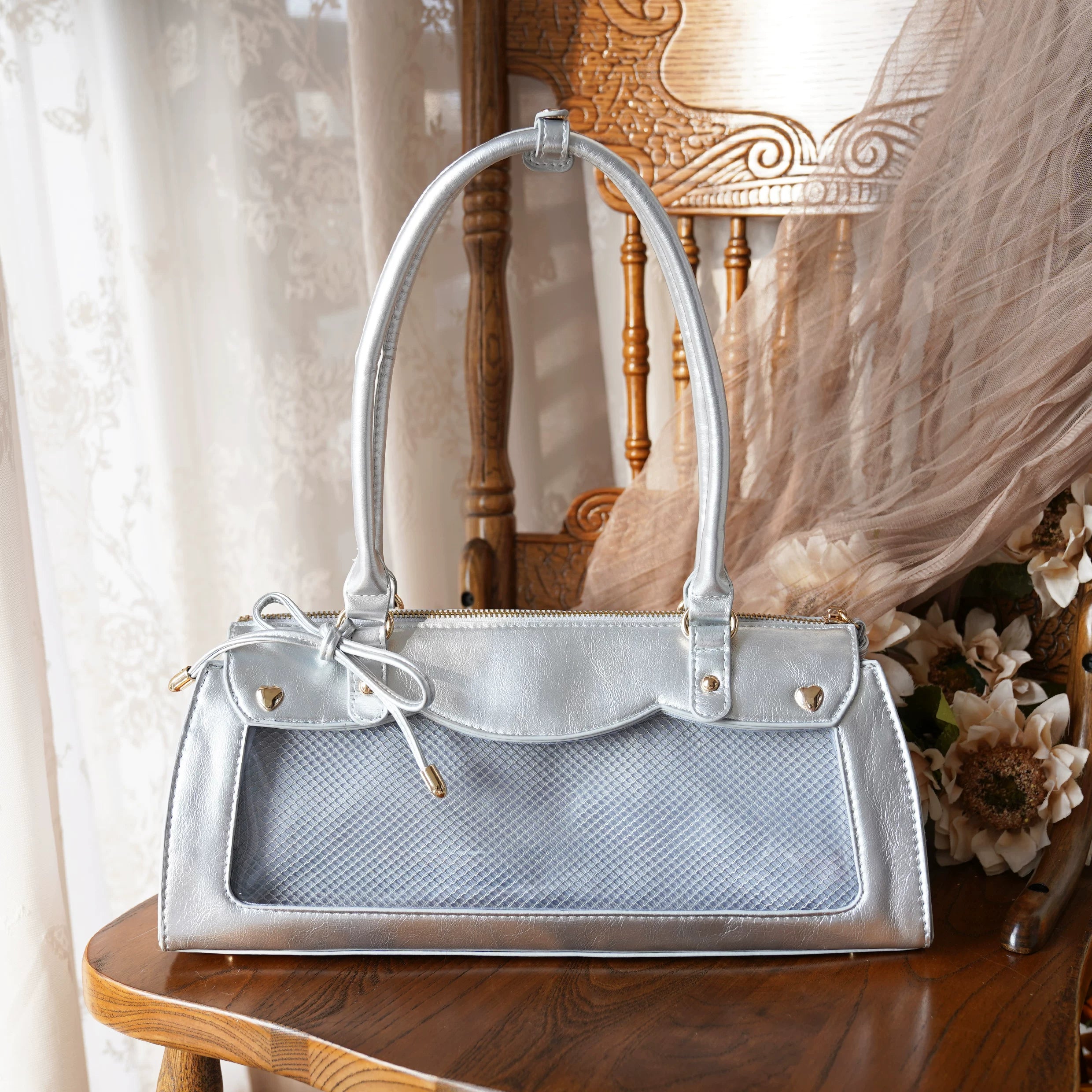 Silver baguette itabag with clear display panel for anime merchandise collection and removable crossbody strap