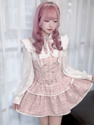 Pink plaid Jirai Kei suspender skirt set with lace ruffled edges and double-breasted design, full-body front portrait of model