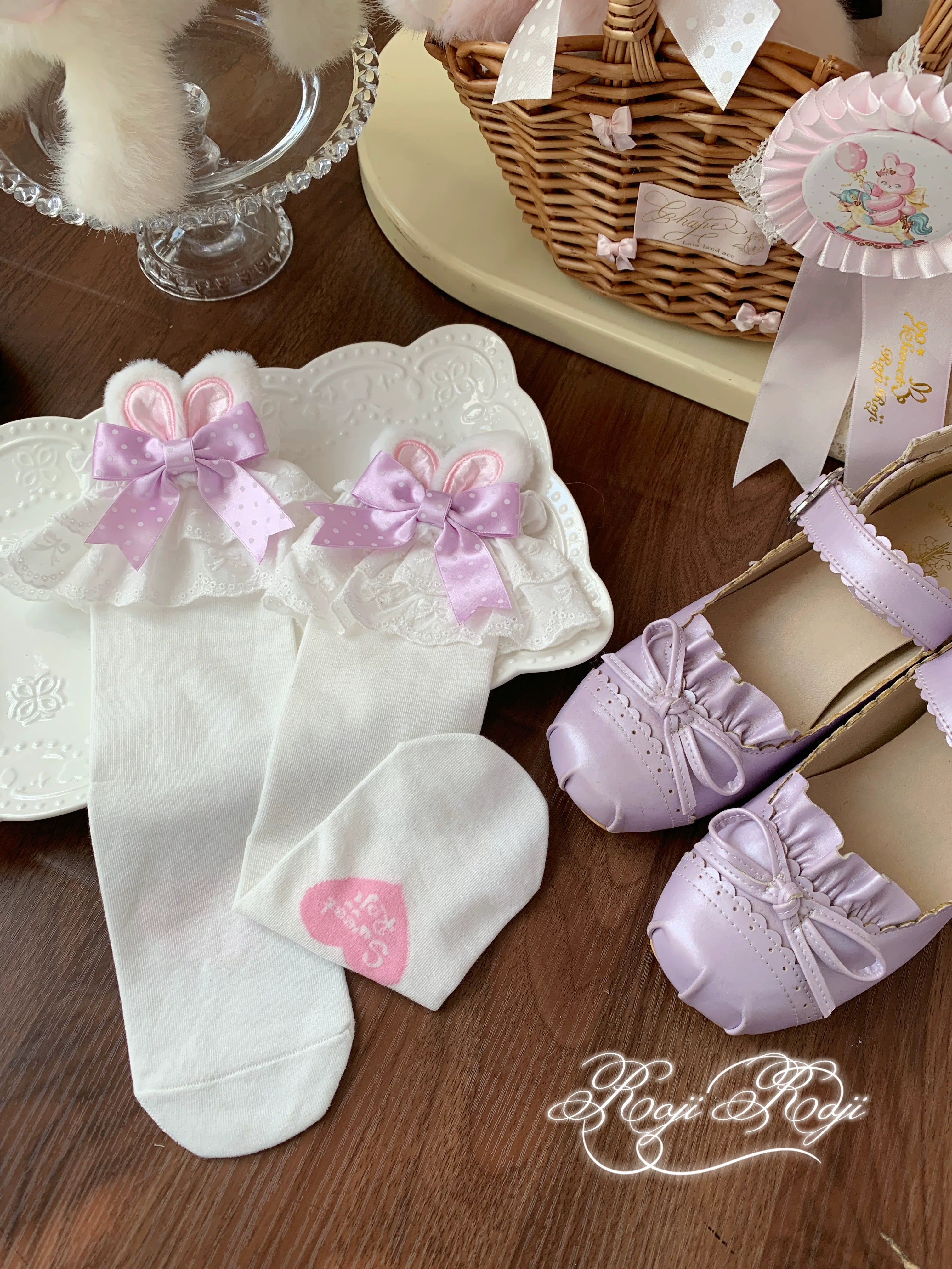 Jirai Kei water blue polka dot bunny ear socks with white base displayed in flat lay showing construction quality and color detail