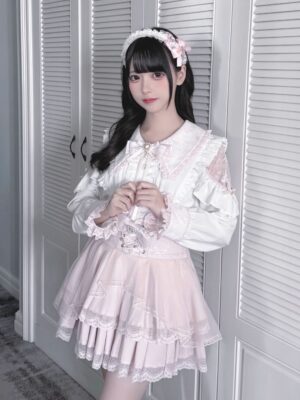 Sweet Lolita pink tiered ruffled lace skirt with white delicate blouse, full coordinate set, Jirai Kei style, model wearing closet scene, medium front shot