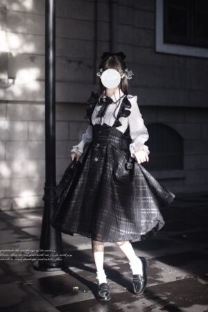 Seiso Kei two-piece coordinate featuring white lace-trimmed blouse and dark plaid suspender skirt on model wearing vintage street styling with hair accessories