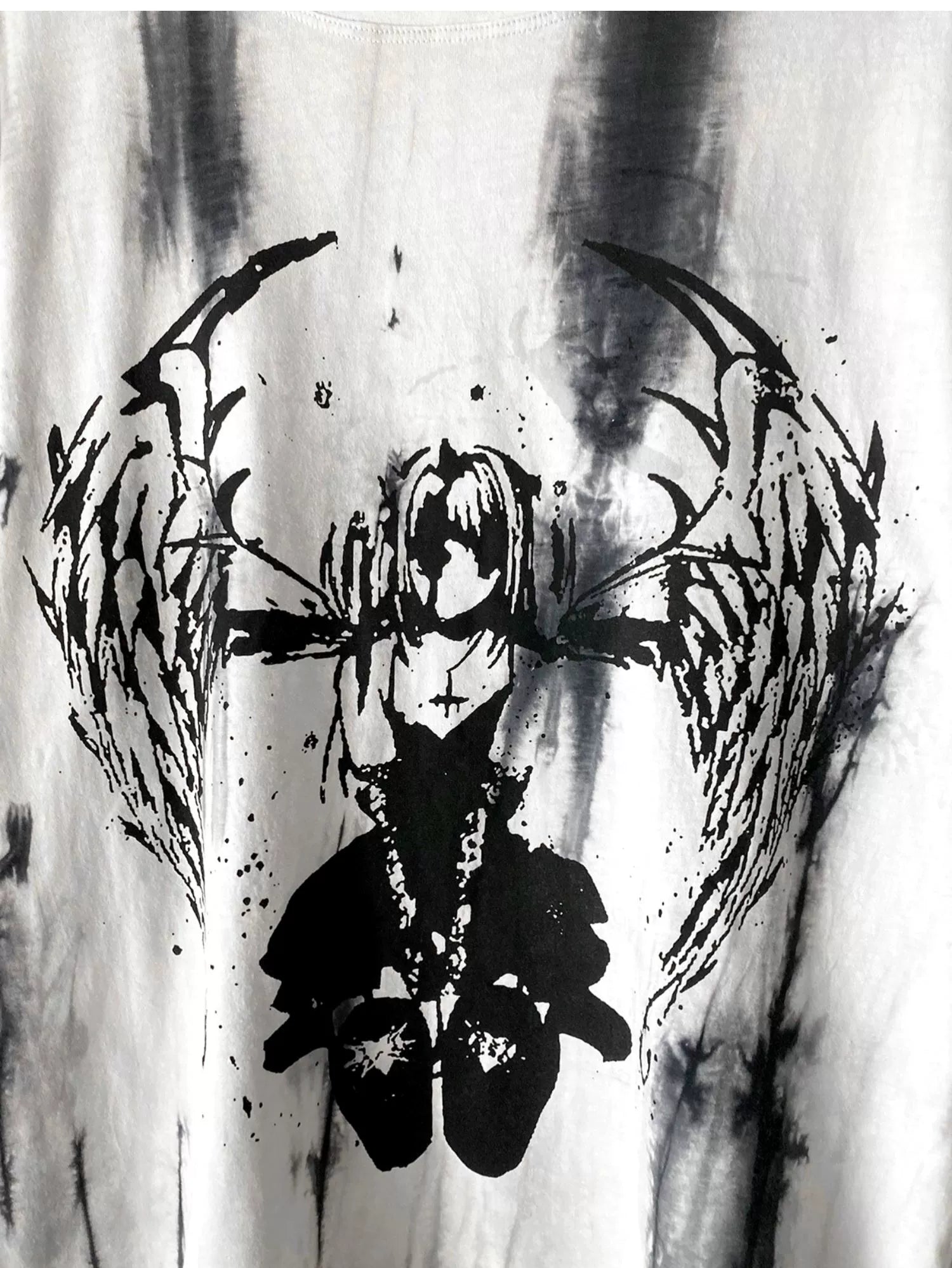 Neckline and sleeve detail of oversized tie-dye gothic jirai kei angel t-shirt showing construction quality and print application