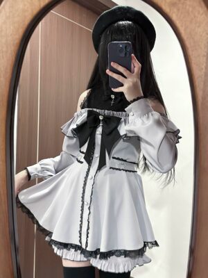 Gray Jirai Kei off-shoulder lace dress with black lace hemline, bow decoration, and pearl trim styled with beret and long black hair