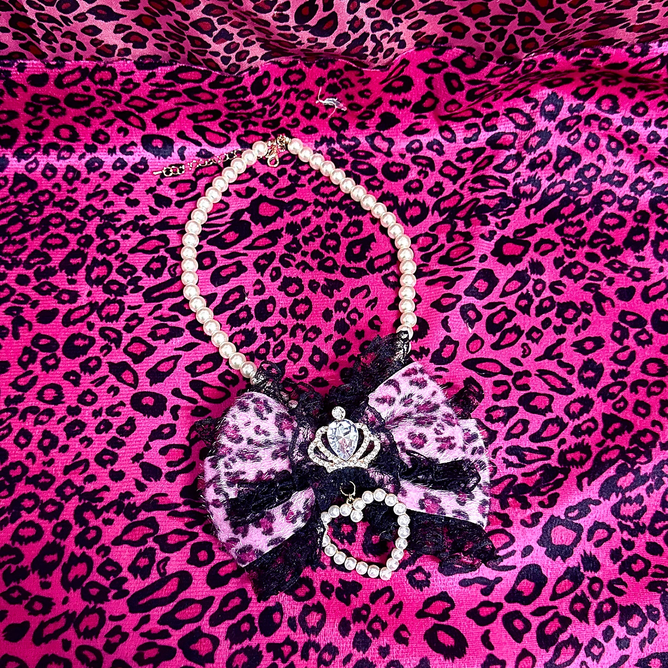 Rose red leopard pearl choker necklace with crown rhinestone pearl heart and lace trim flat lay product shot