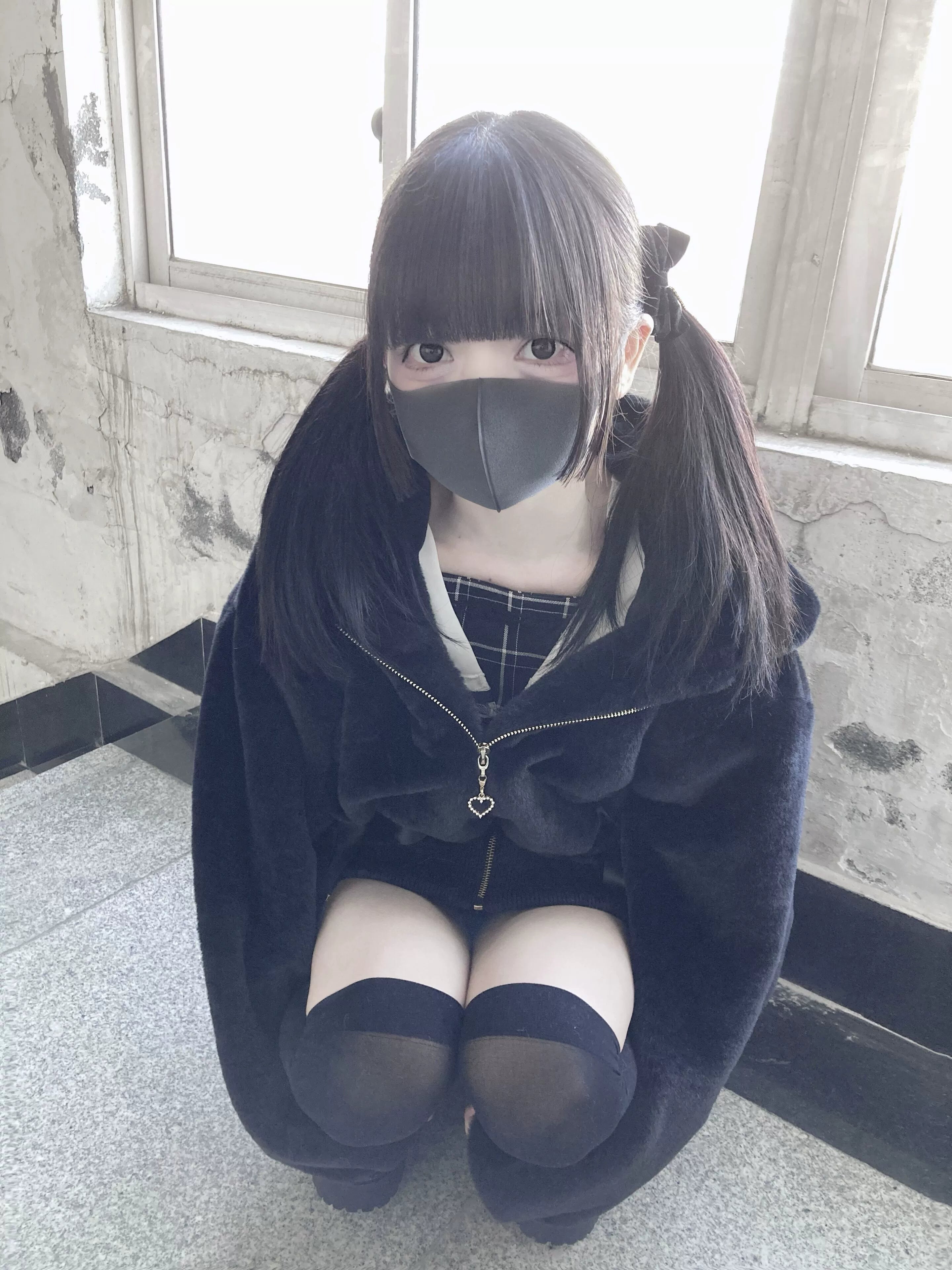 Black fleece coat with bunny ears hood and heart zipper styling detail close-up view jirai kei