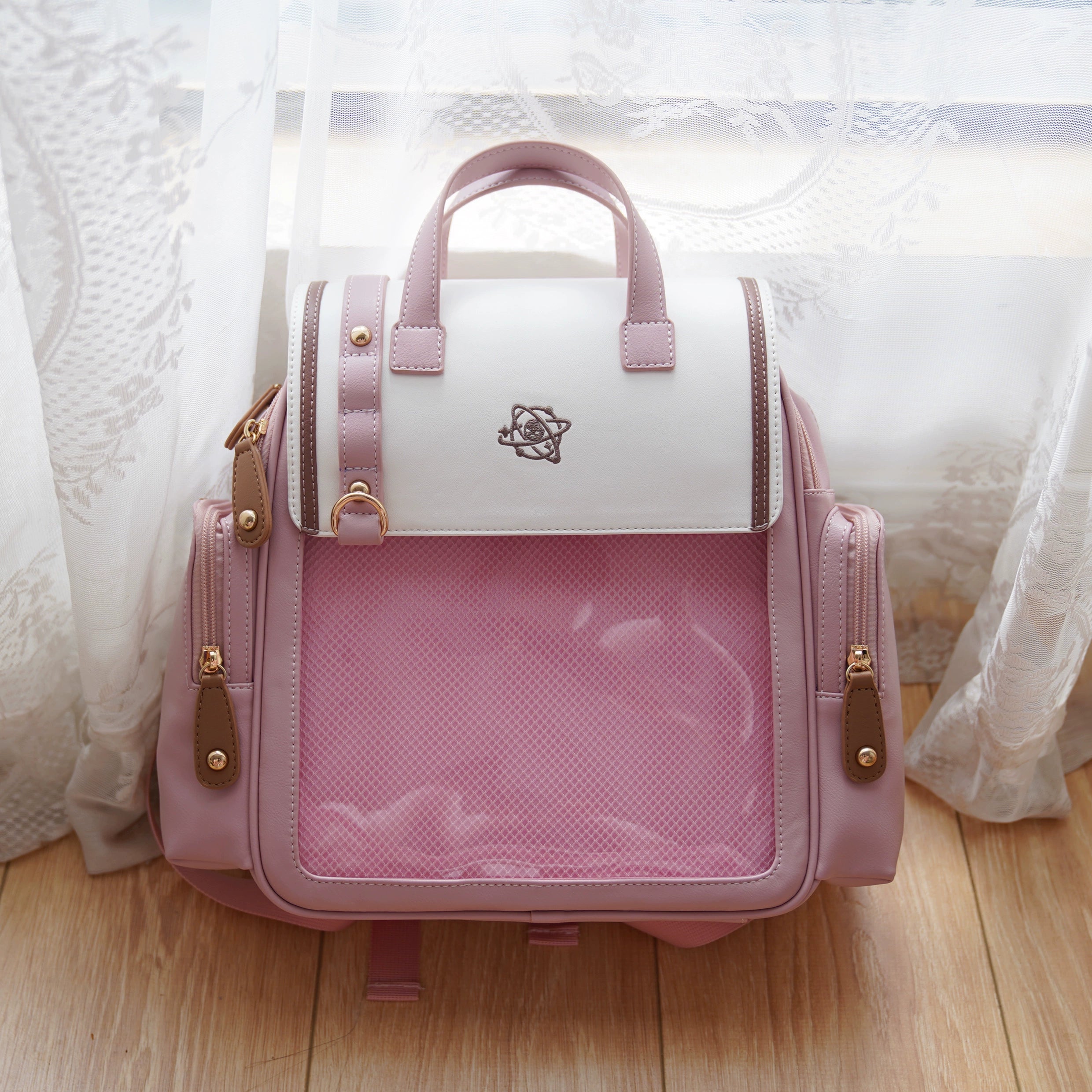 Pink Jirai Kei itabag backpack flat frontal view with transparent display window and two-tone color design