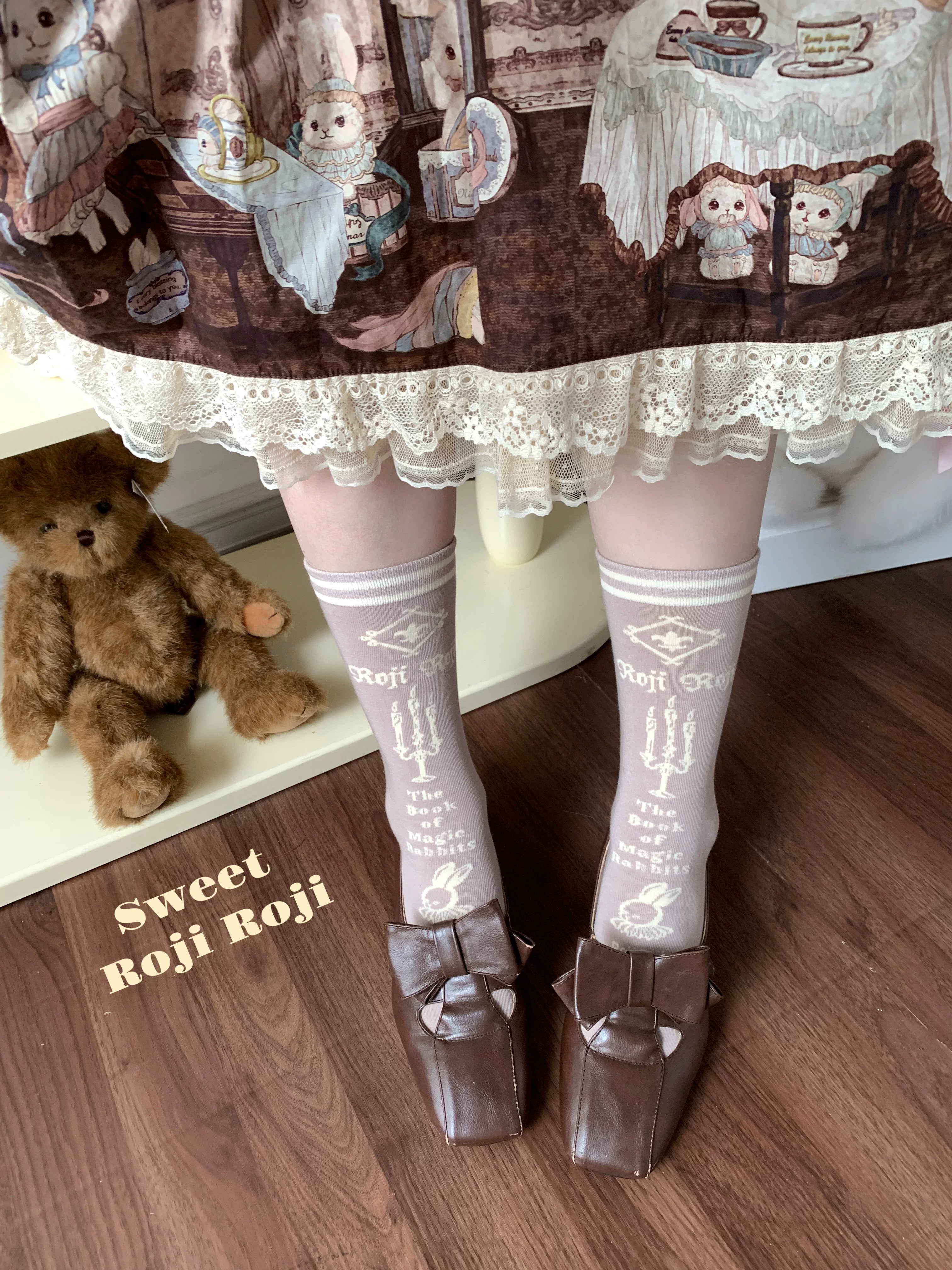 Jirai Kei beige light gray vintage mid-calf socks with printed motifs paired with bear print skirt and Mary Jane shoes
