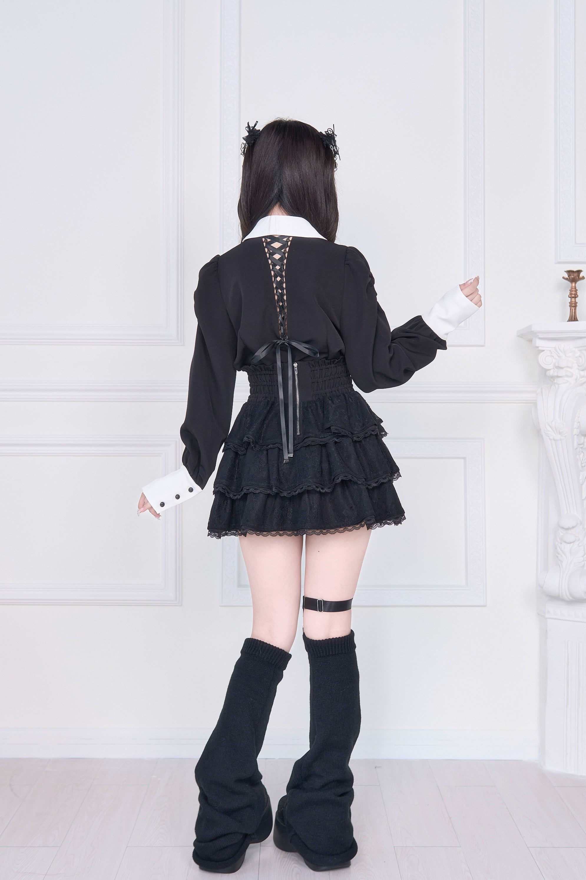 Jirai Kei two-piece outfit back view lace-up blouse high-waisted tiered skirt black leg warmers