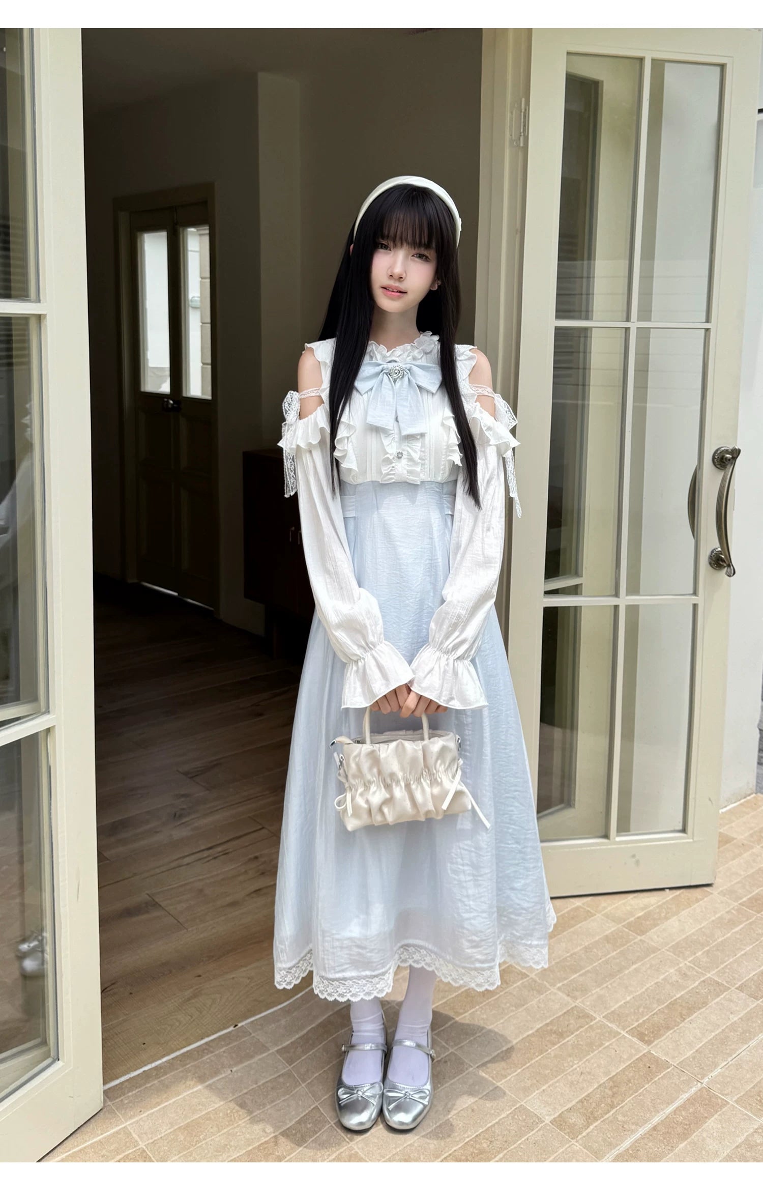 Seiso Kei long dress with long sleeves featuring blue and white color block and cold-shoulder design