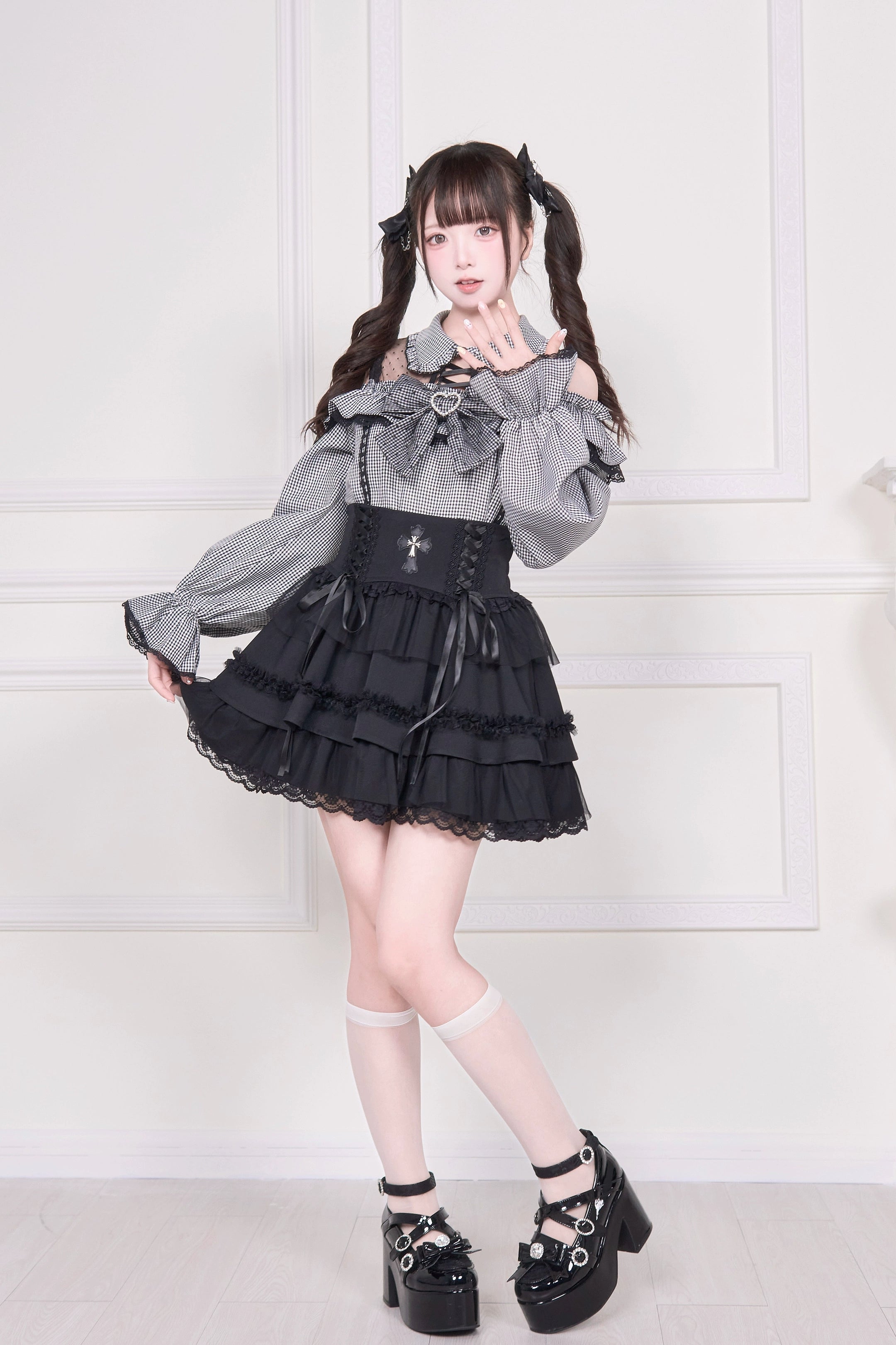 Grey gingham Jirai Kei blouse side three-quarter view with ruffled details and platform shoes