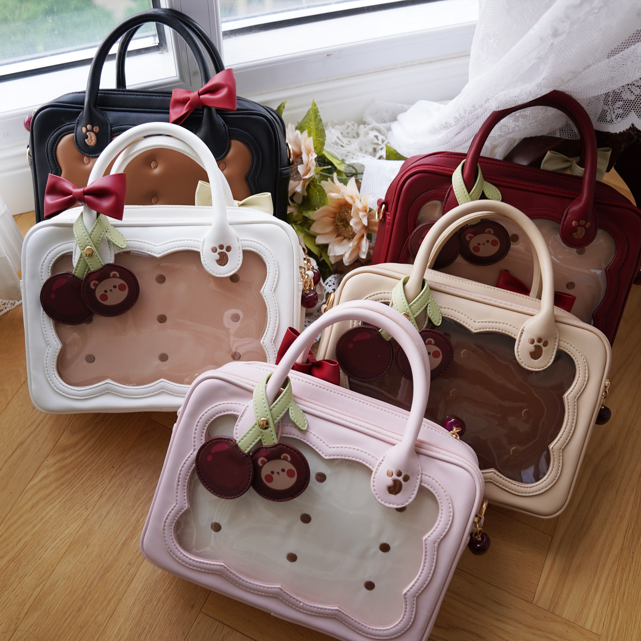 Jirai Kei cherry bear cookie bag in studio lighting showing product details strawberry buckle and bow accents professional shot