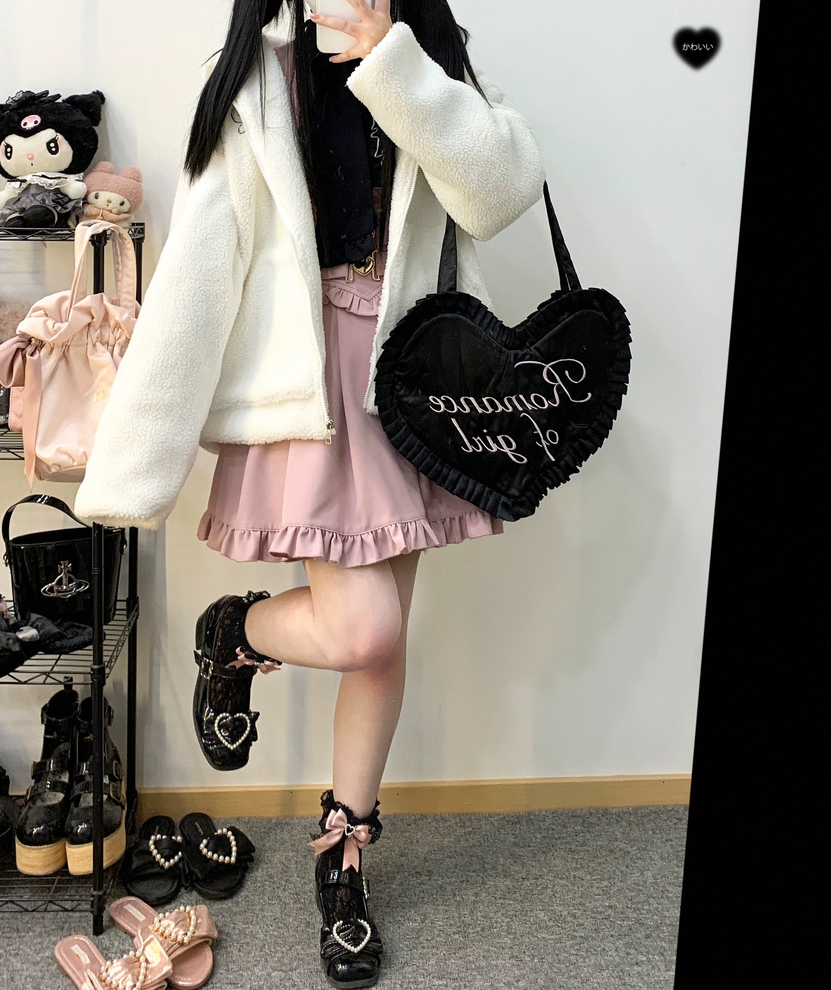 High waist V-line Jirai Kei suspender skirt with ruffled hem detail and decorative heart buckle waistband flat lay product photography
