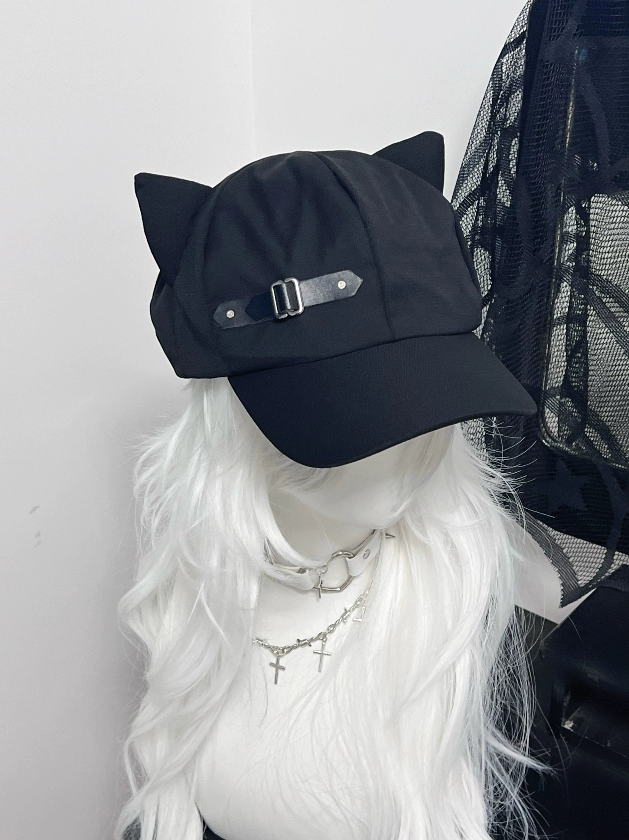 Black cat ear beret cap left oblique top view, short brim design, solid black fabric, classic feline ear crown silhouette, gothic aesthetic