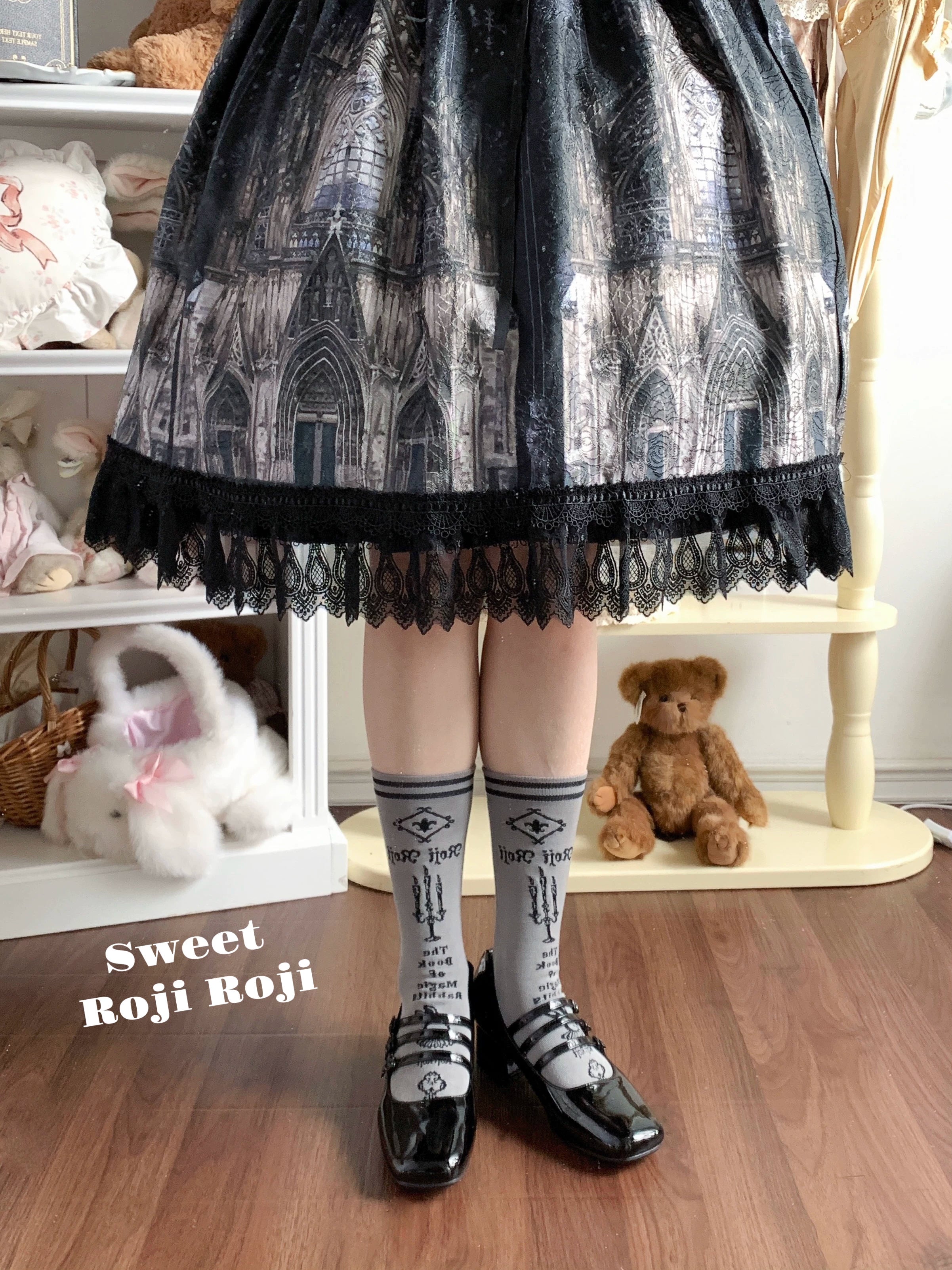 Jirai Kei dark gray mid-calf socks with vintage printed patterns styled with cathedral print skirt and teddy bear decor