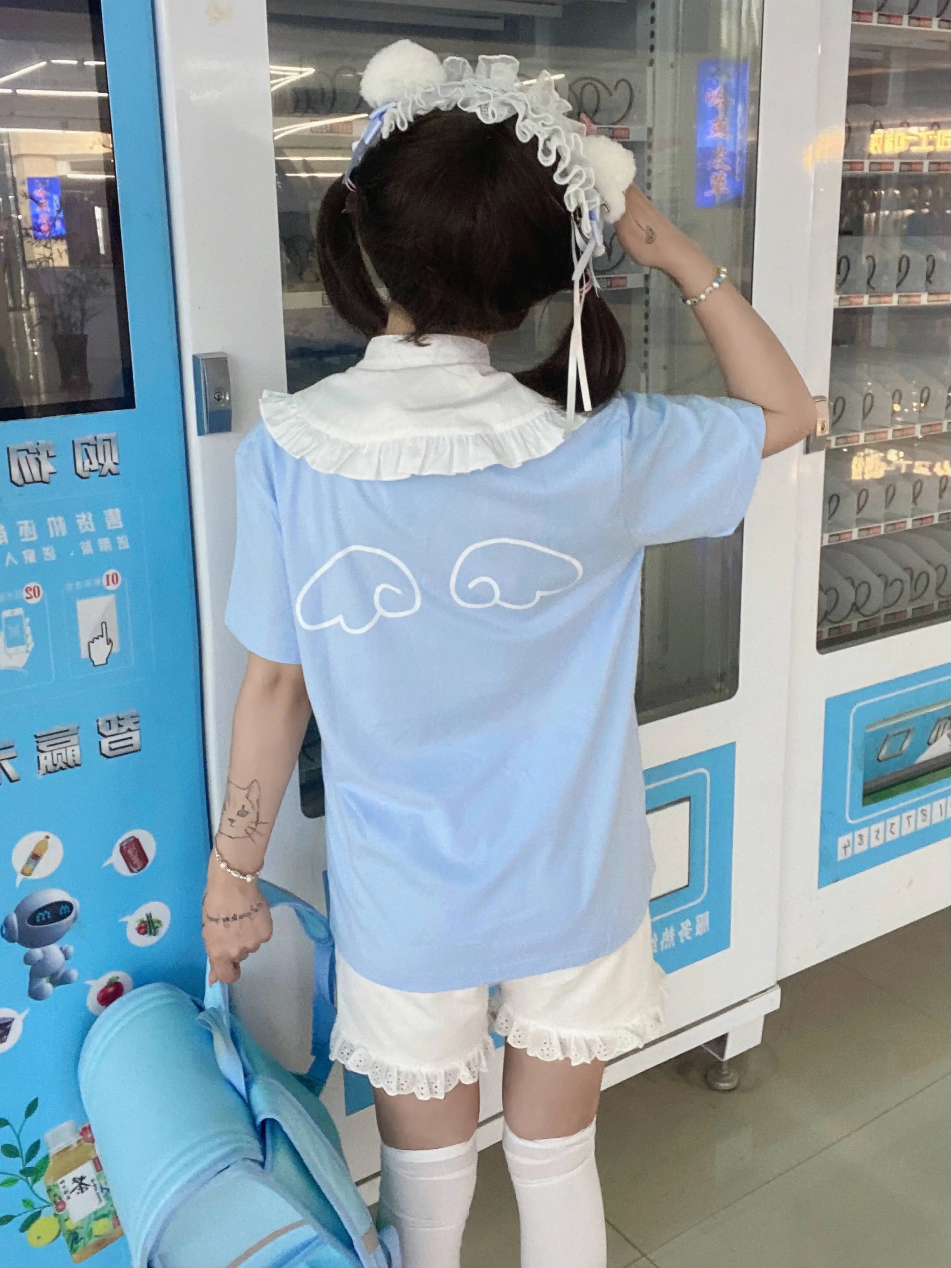 Light blue Tenshi Kaiwai cotton T-shirt back view with angel wing pattern print white ruffled collar detail