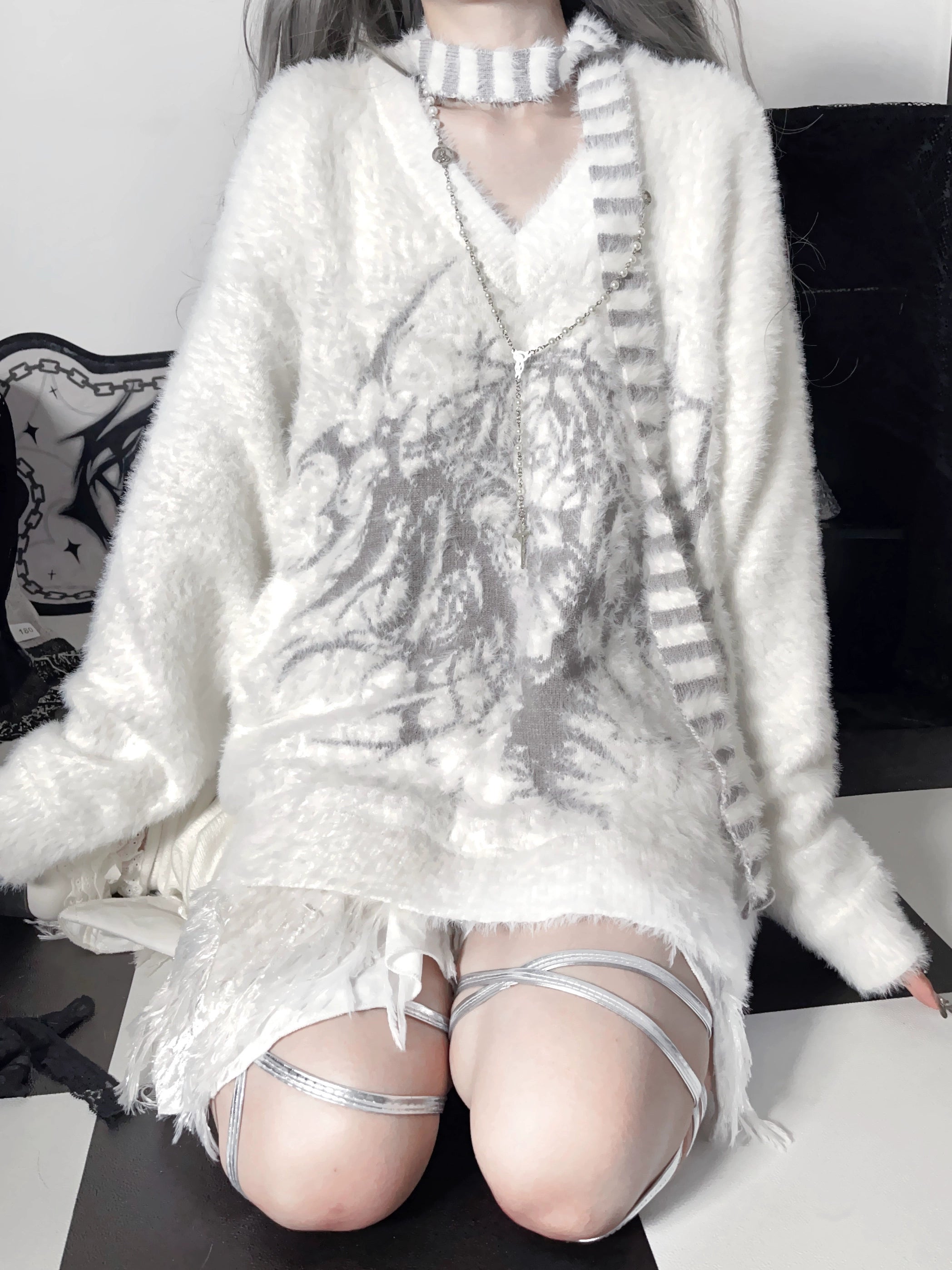 Jirai Kei V-neck sweater with anime graphic print and matching striped scarf overhead view gothic aesthetic