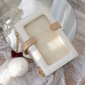 White jirai kei diary card itabag with transparent window display flat lay top view showing pom-pom charm and leather design details