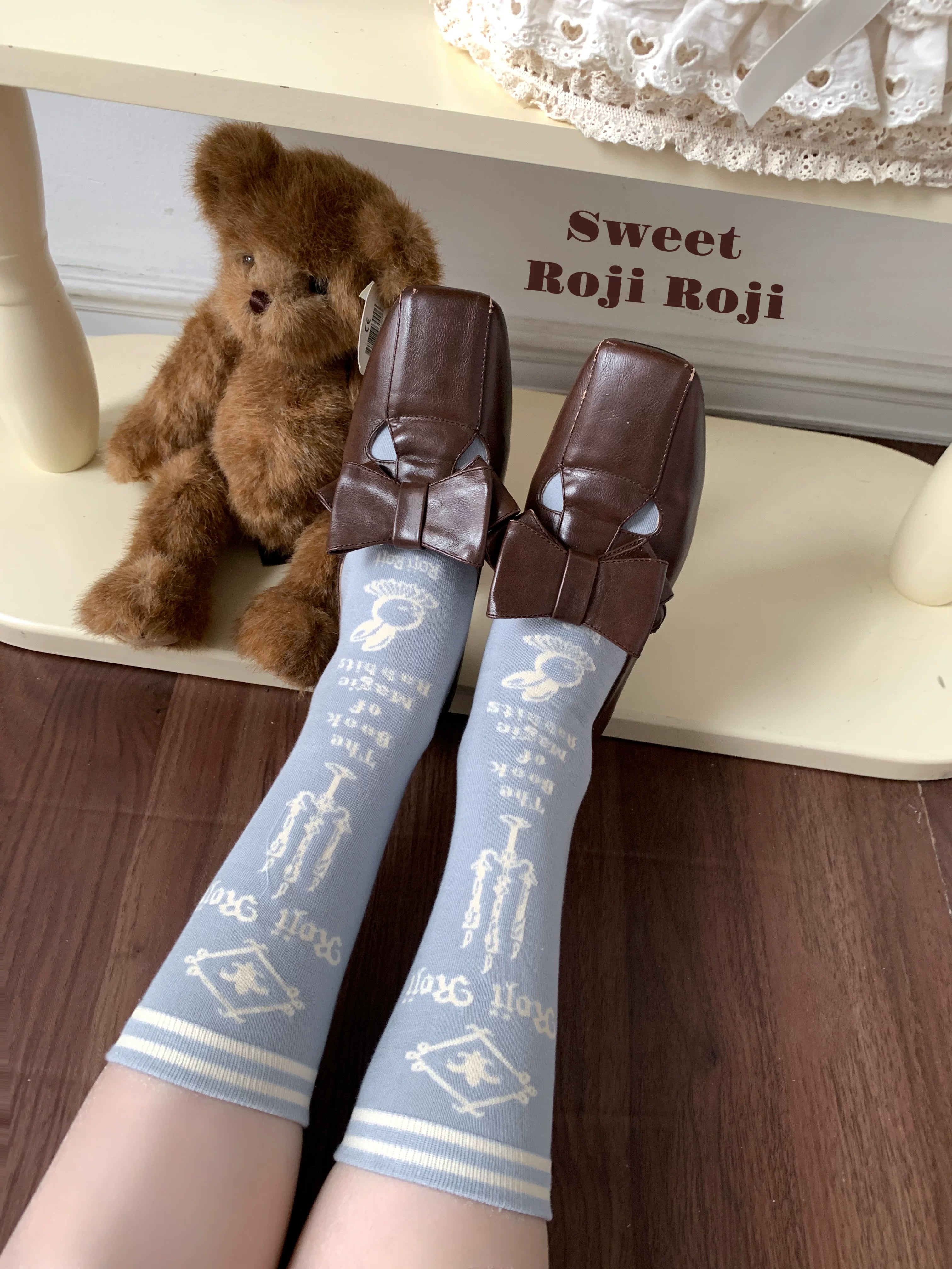 Jirai Kei gray-blue light blue mid-calf socks with key letter prints first-person wearing view with teddy bear decor