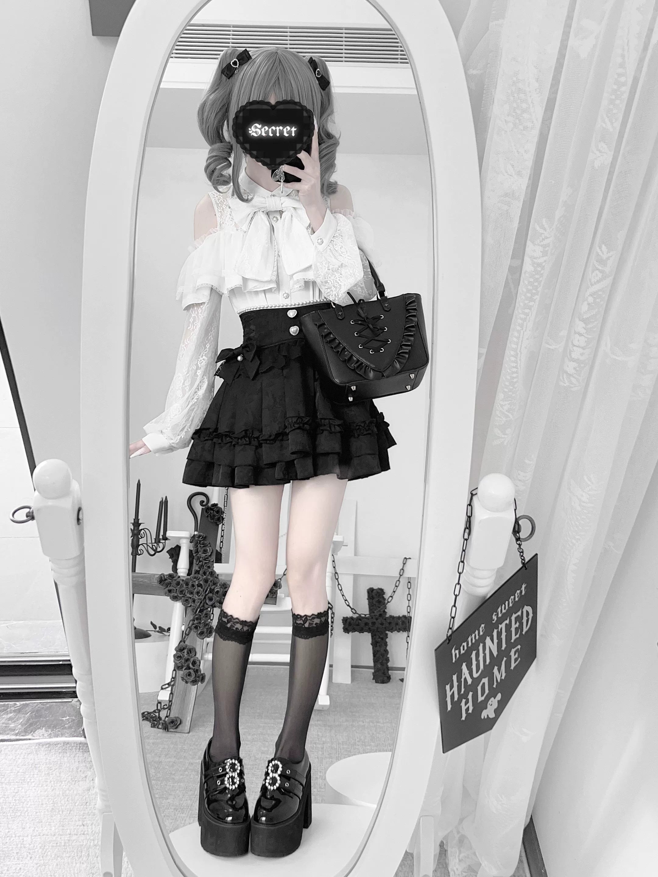 Jirai kei black ruffle mini skirt styling inspiration with heart-shaped button waist detail and layered ruffles, multiple angle view