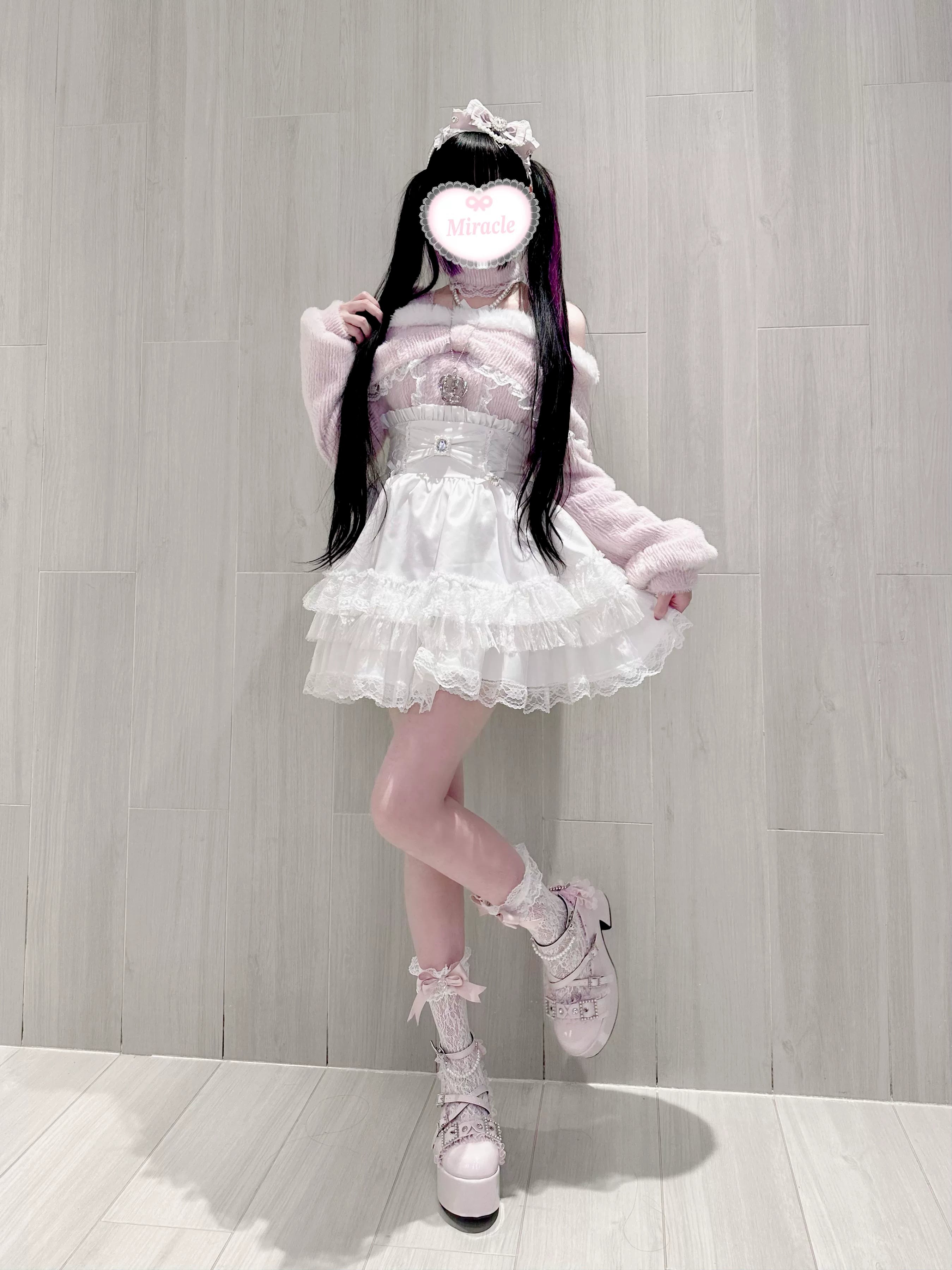 Off-shoulder plush top layered with long-sleeve mesh shirt and gothic accessories demonstrating Jirai Kei digital goth styling approach