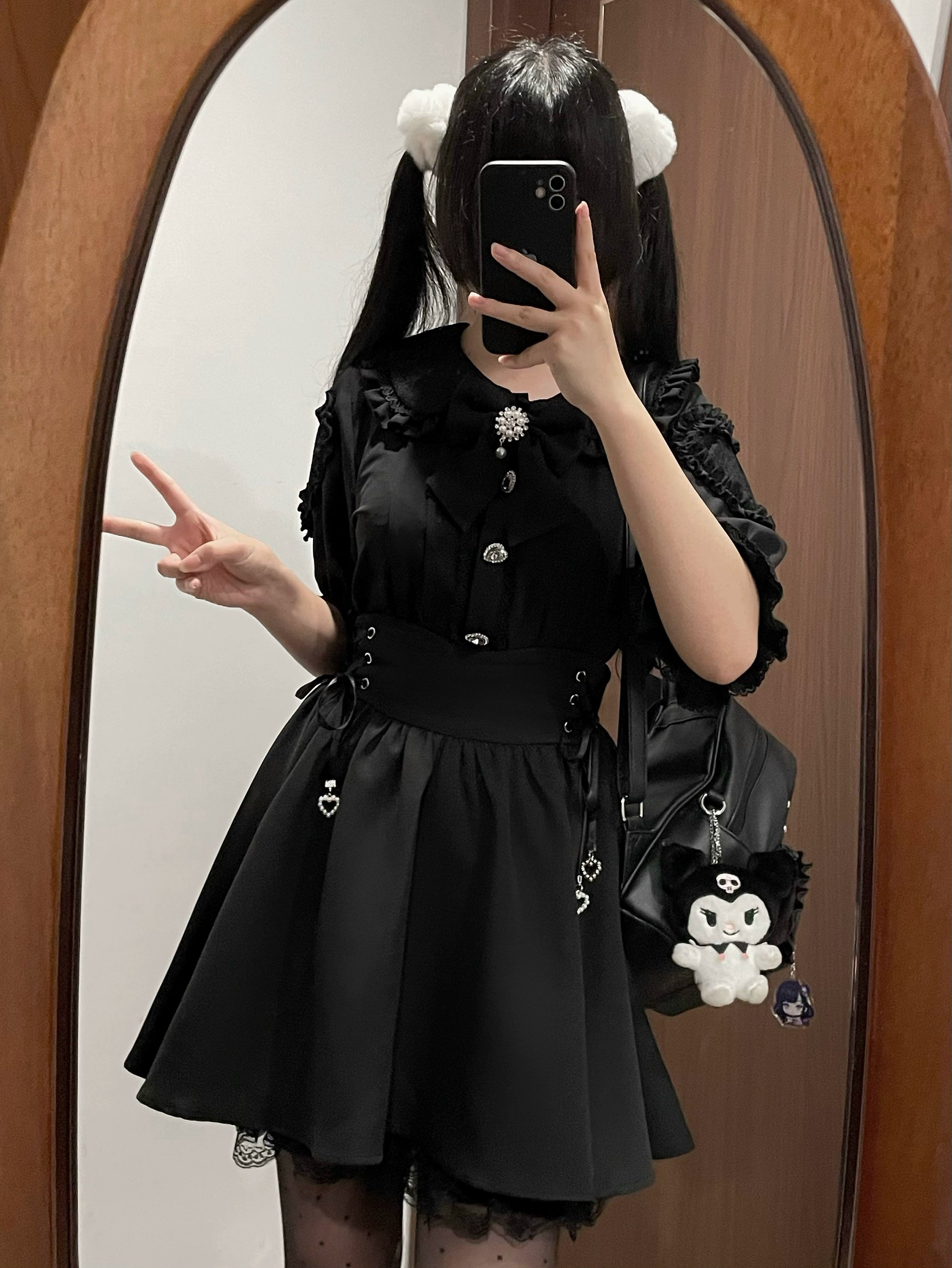 Full-body black Jirai Kei dress set mirror selfie on twin-tailed white-haired anime girl model, paired with skull-themed crossbody bag and platform gothic shoes - complete alternative fashion outfit styling