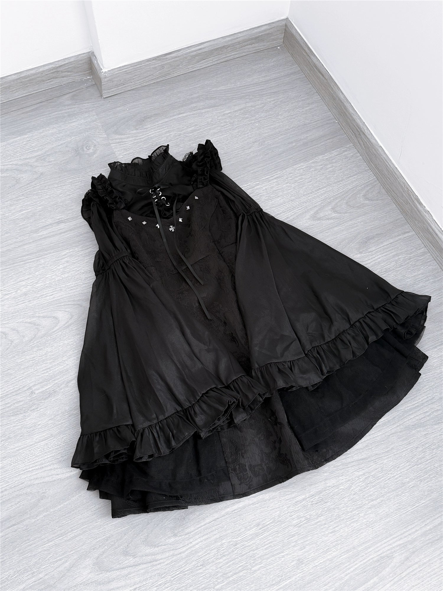 Black Jirai Kei jumper dress standalone flat lay showing studded details textured jacquard and color tone