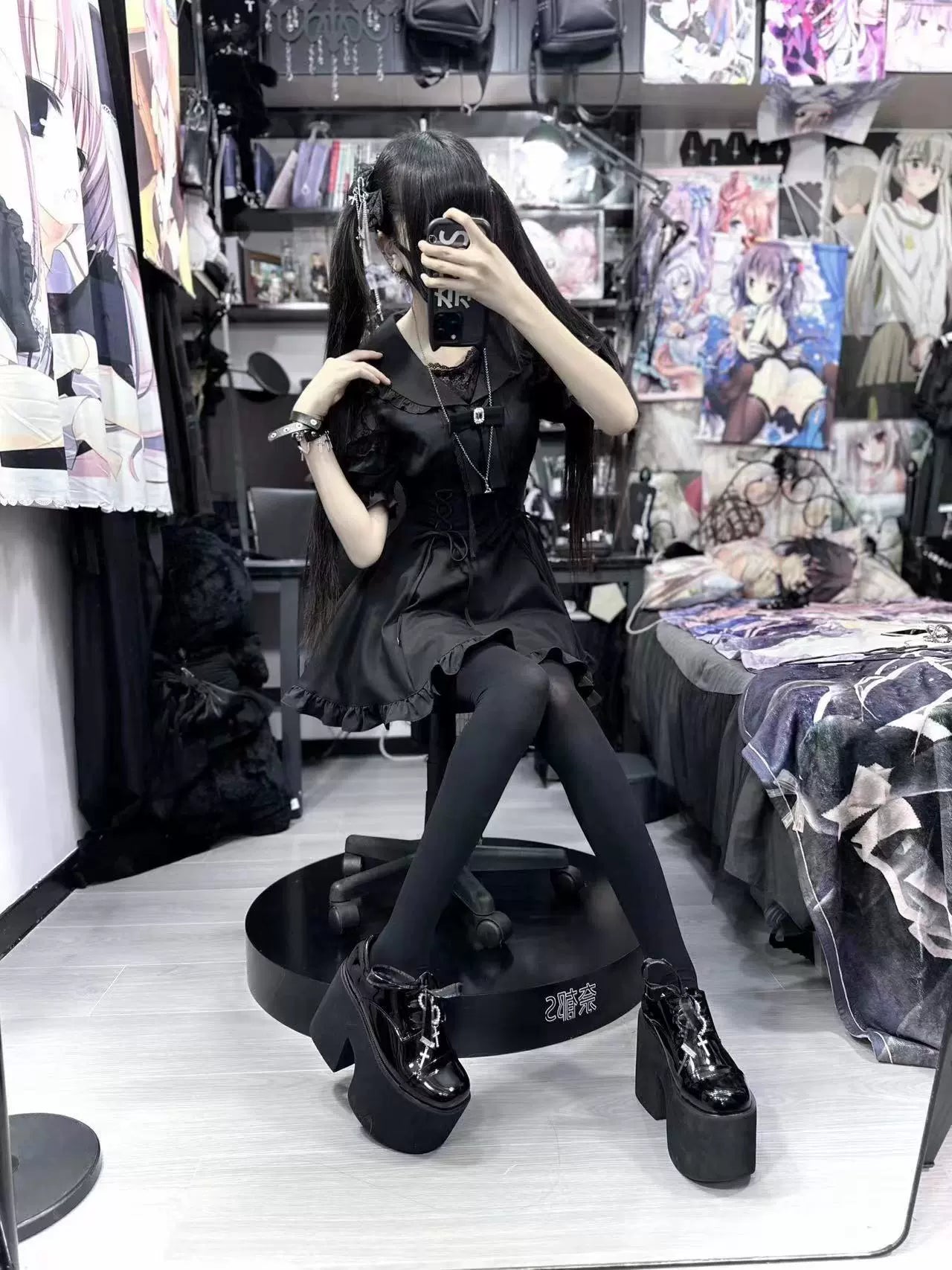 Model in black Jirai Kei sailor dress with platform boots and twin tails back-side mirror view
