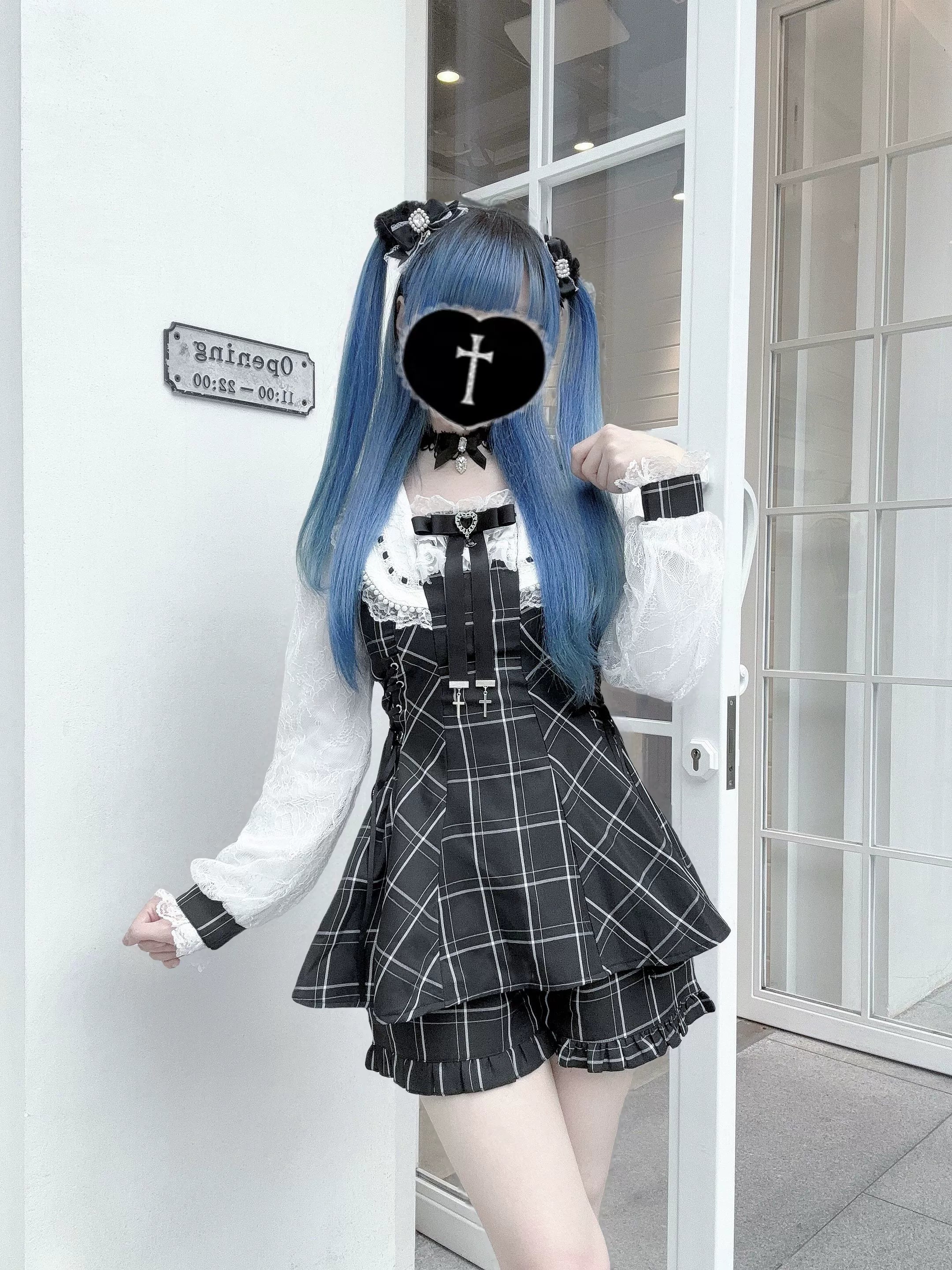 Plaid Jirai Kei two-piece set on model with blue twin tails hairstyle featuring pocketed shorts and lace blouse in three-quarter front view