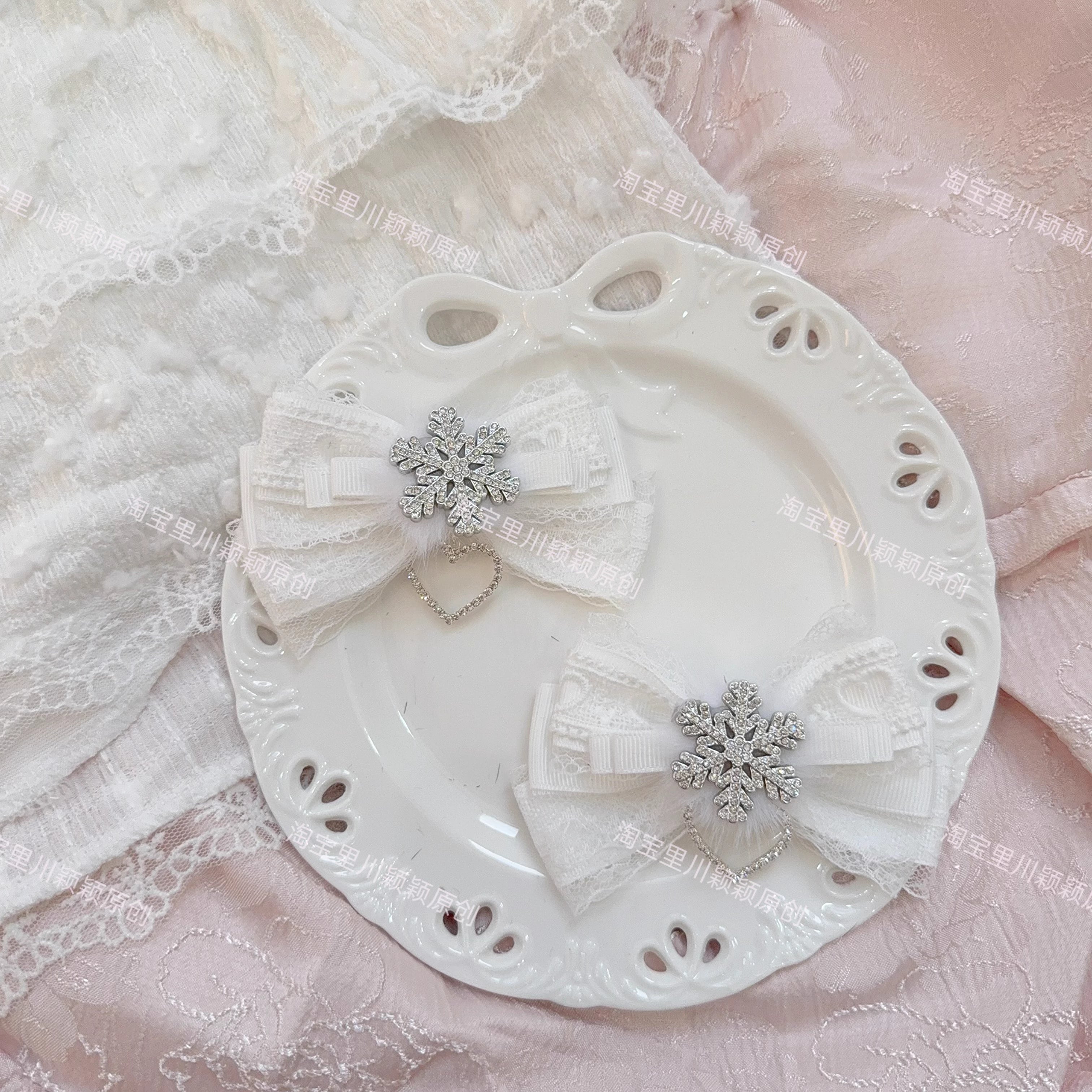 Pure white Jirai Kei bow hair clips with delicate lace cut-out silver snowflake decoration heart pendant on white plate ethereal angelic aesthetic