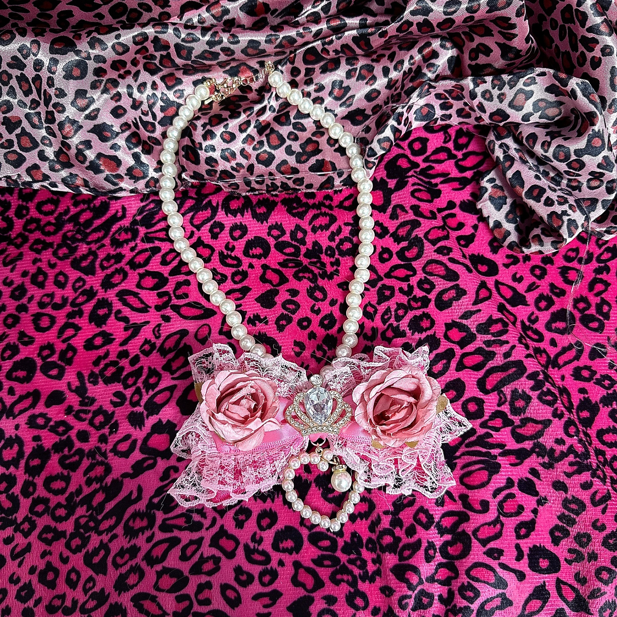 Jirai Kei bold pink rose floral bow pearl necklace flat lay full design with pearl chain heart charm details