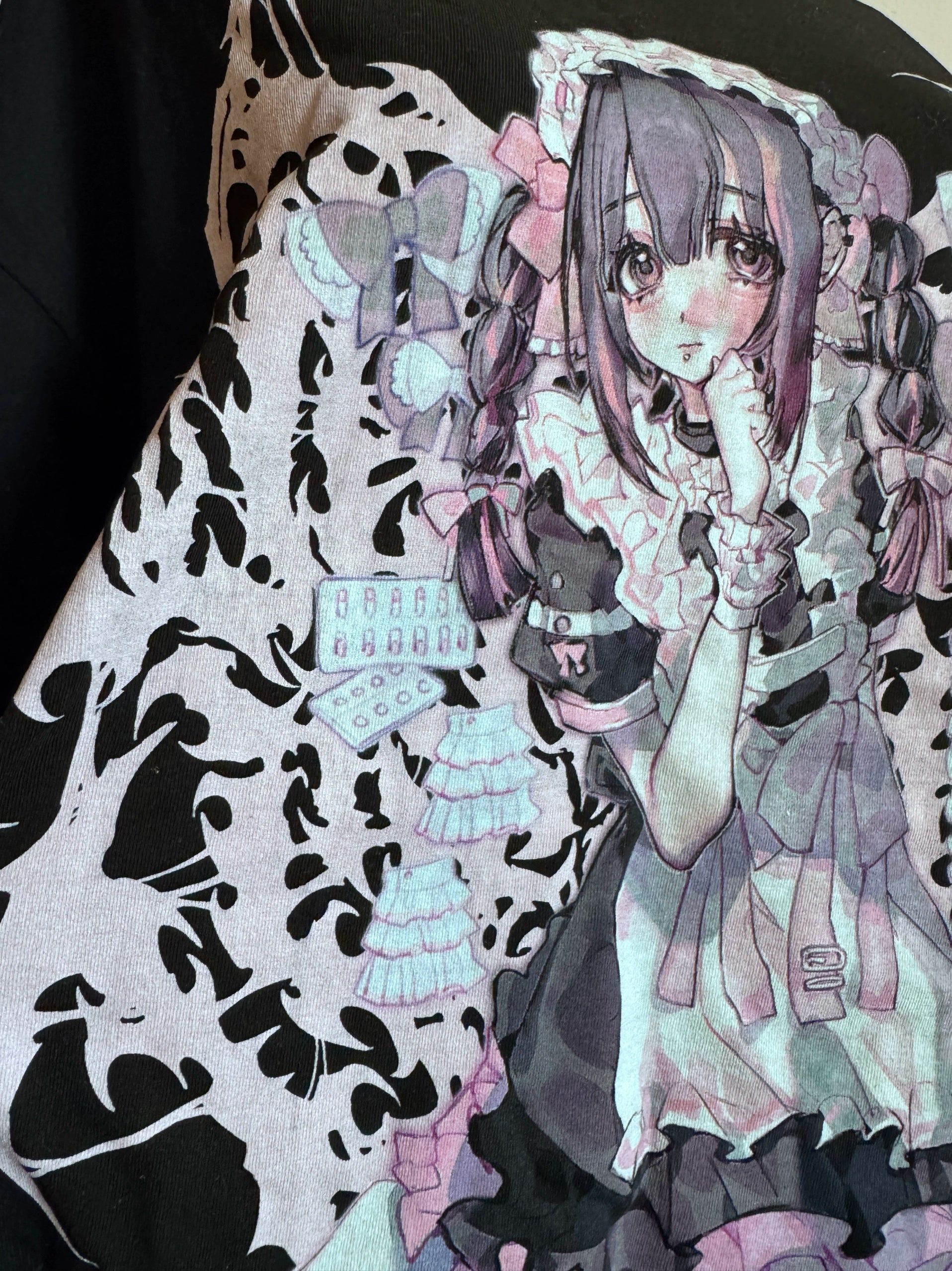 Detailed close-up of anime girl maid graphic print on black cotton Jirai Kei oversized t-shirt, highlighting DTG print quality and gothic punk aesthetic design elements