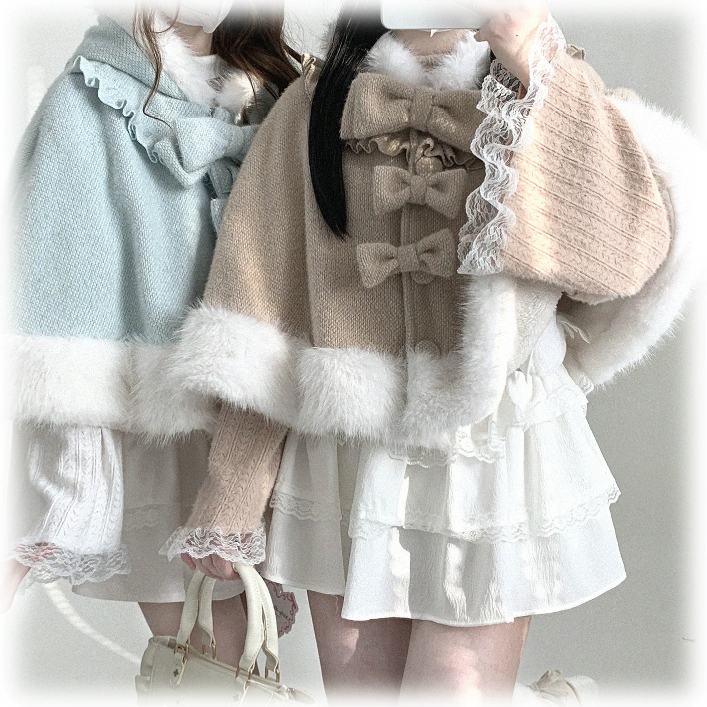 Side close-up profile view of cat-ear hooded cape in light blue showing white fur hem, decorative bow, button elements, and lace-trimmed details