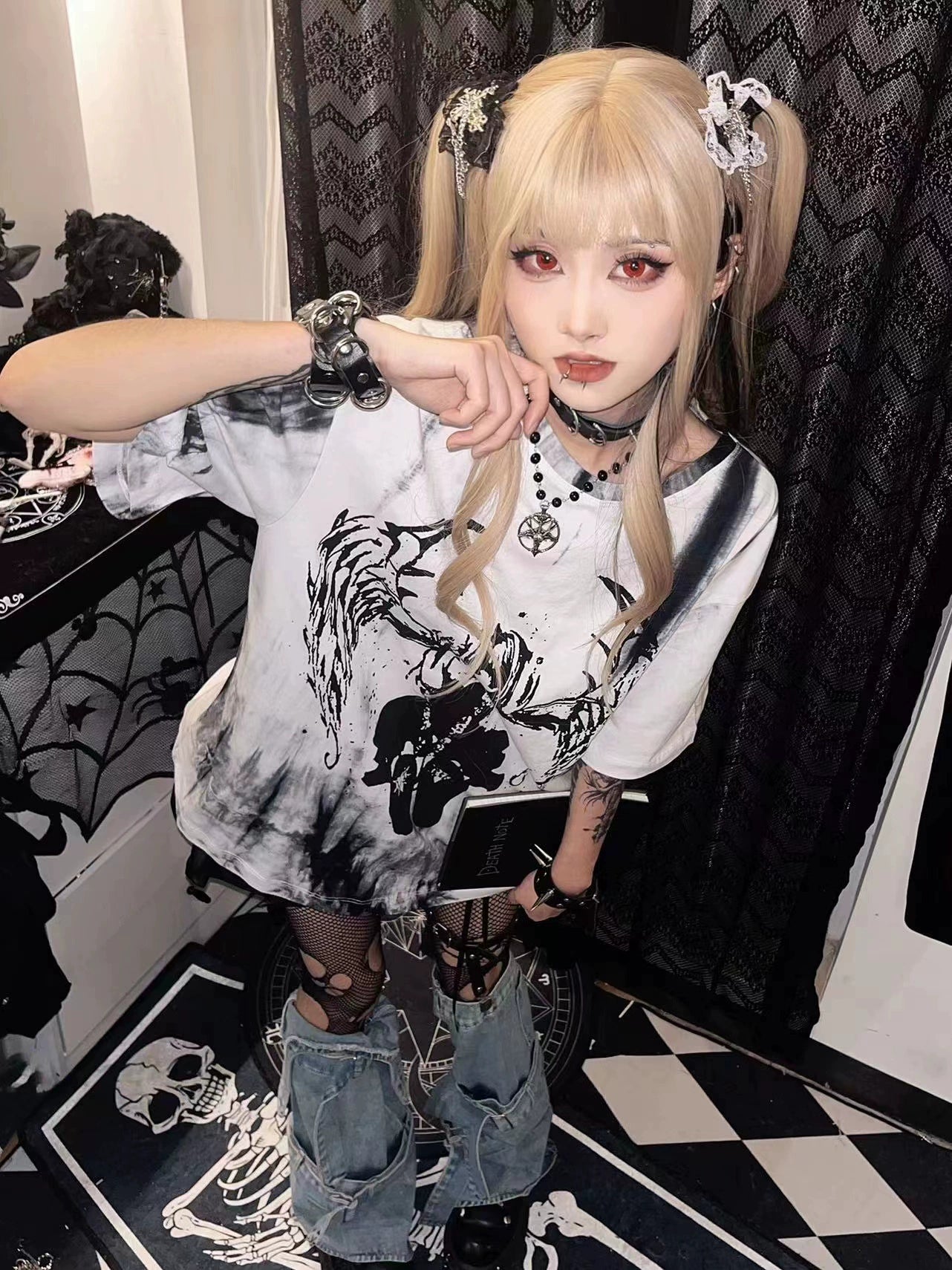 Celestial angel wings tie-dye gothic jirai kei unisex t-shirt flat lay front view showing graphic print detail and color variation