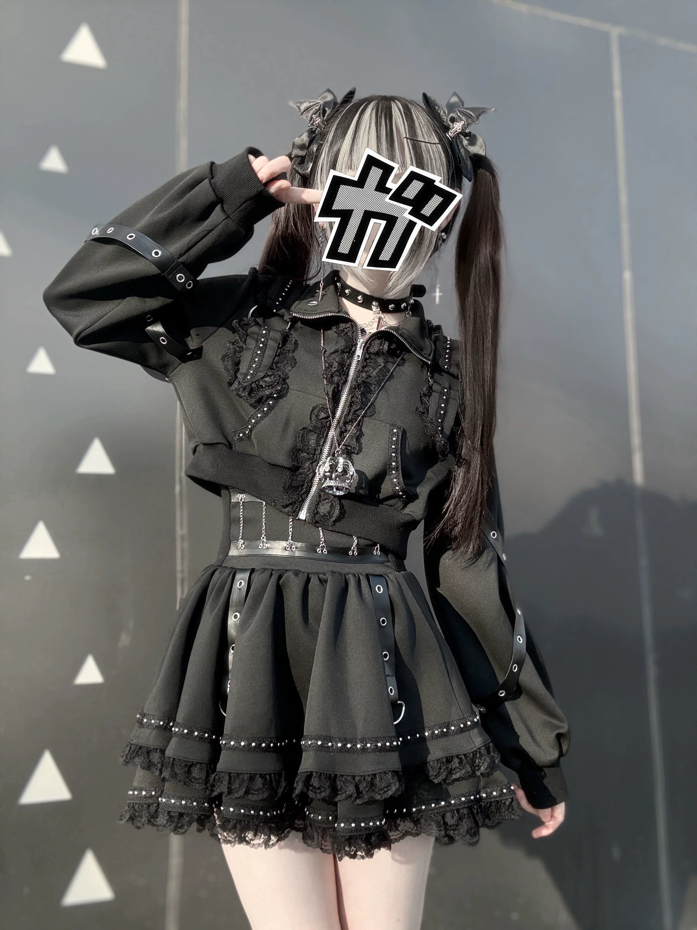 Gothic cropped jacket and mini skirt set front medium shot cross zipper studded hem lace trims twin-tailed model triangle pattern wall