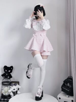 Pink plaid Jirai Kei dress and shorts combo displayed from front angle with model wearing white thigh-high socks and platform loafers demonstrating styling possibilities