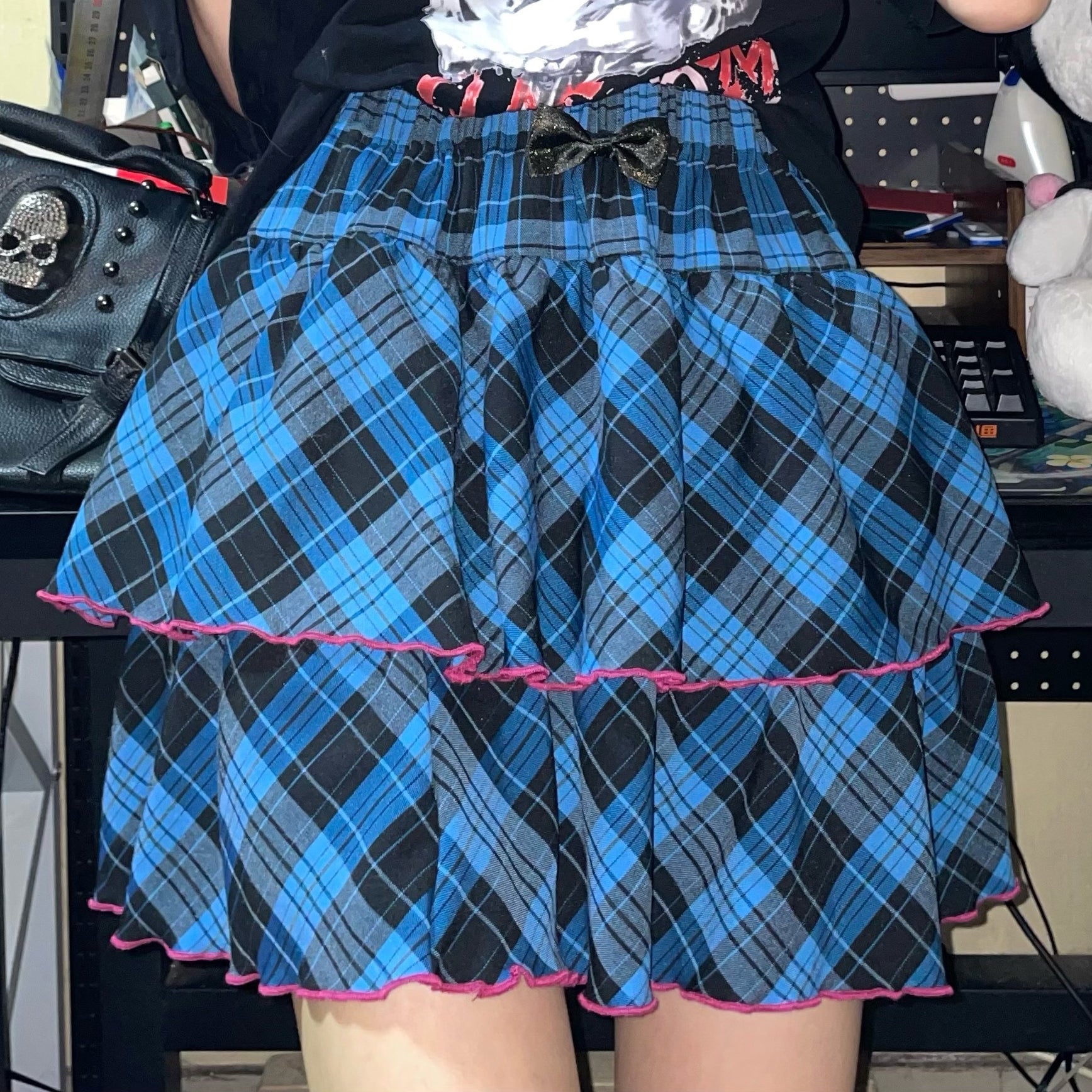 Pink-black plaid Jirai Kei ruffle skirt with large lace bow, double-layer construction, luxury aesthetic detail showcase