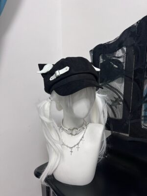 Black Jirai Kei beret with detachable white devil wings leather strap front three quarter angle