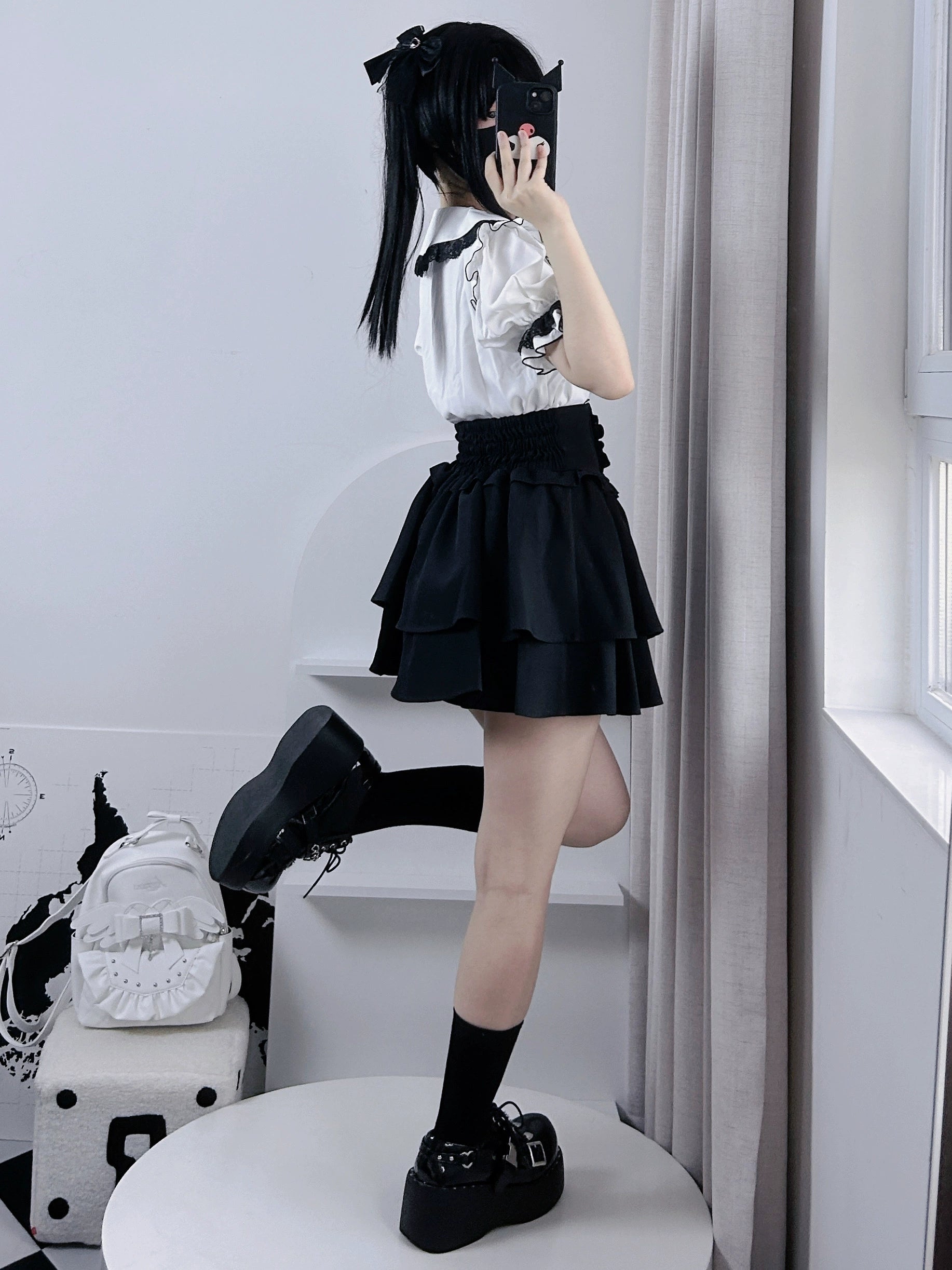 Multi-color jirai kei tiered skirt collection display, various colorway options including pink, blue, black, white, and patterned designs